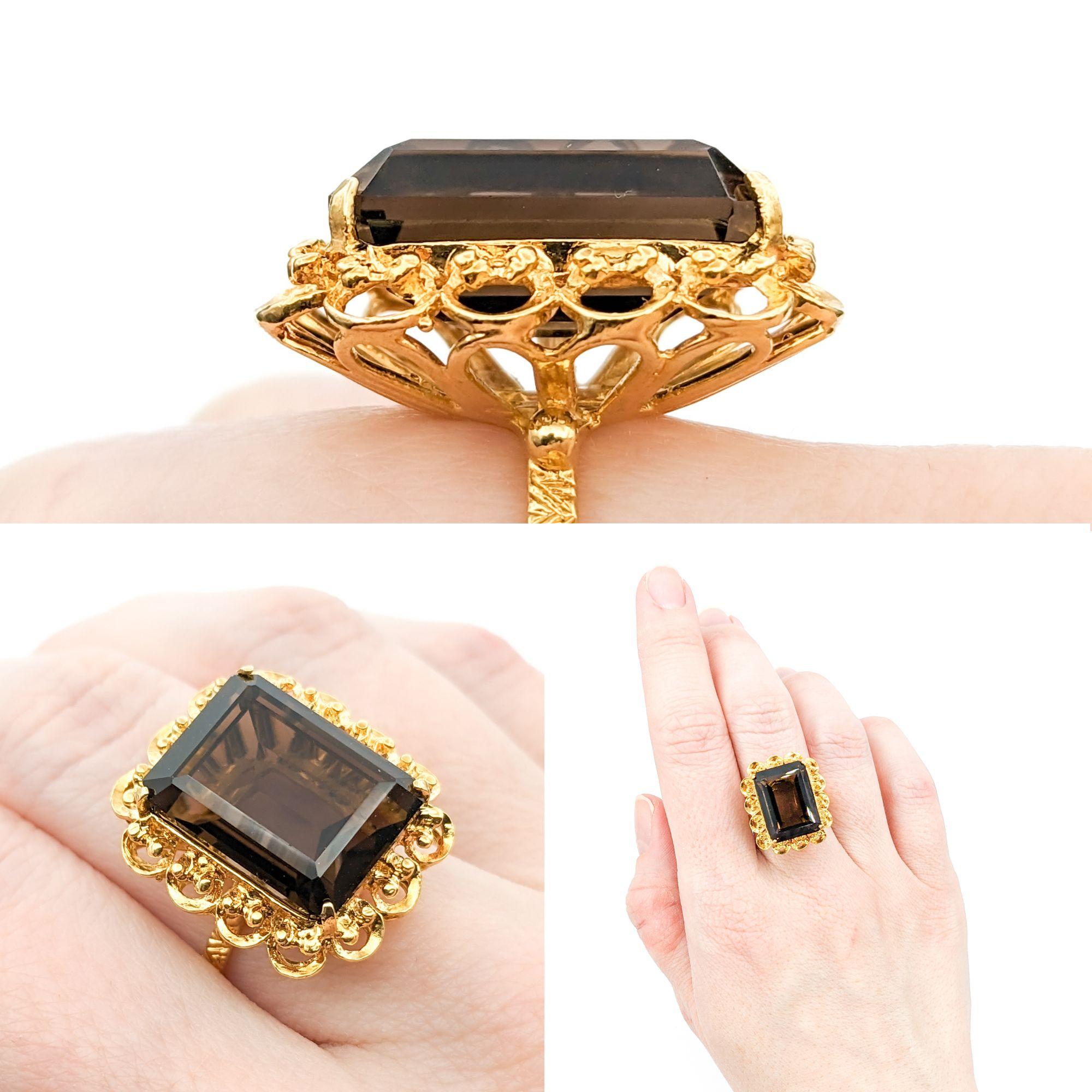Elaborate 18k Smoky Quartz Cocktail Ring

Crafted in 18k yellow gold, this ring showcases a mesmerizing 16x12mm Smoky Quartz at its center. The warm and alluring Smoky Quartz gemstone exudes a captivating charm, creating an exquisite focal point for