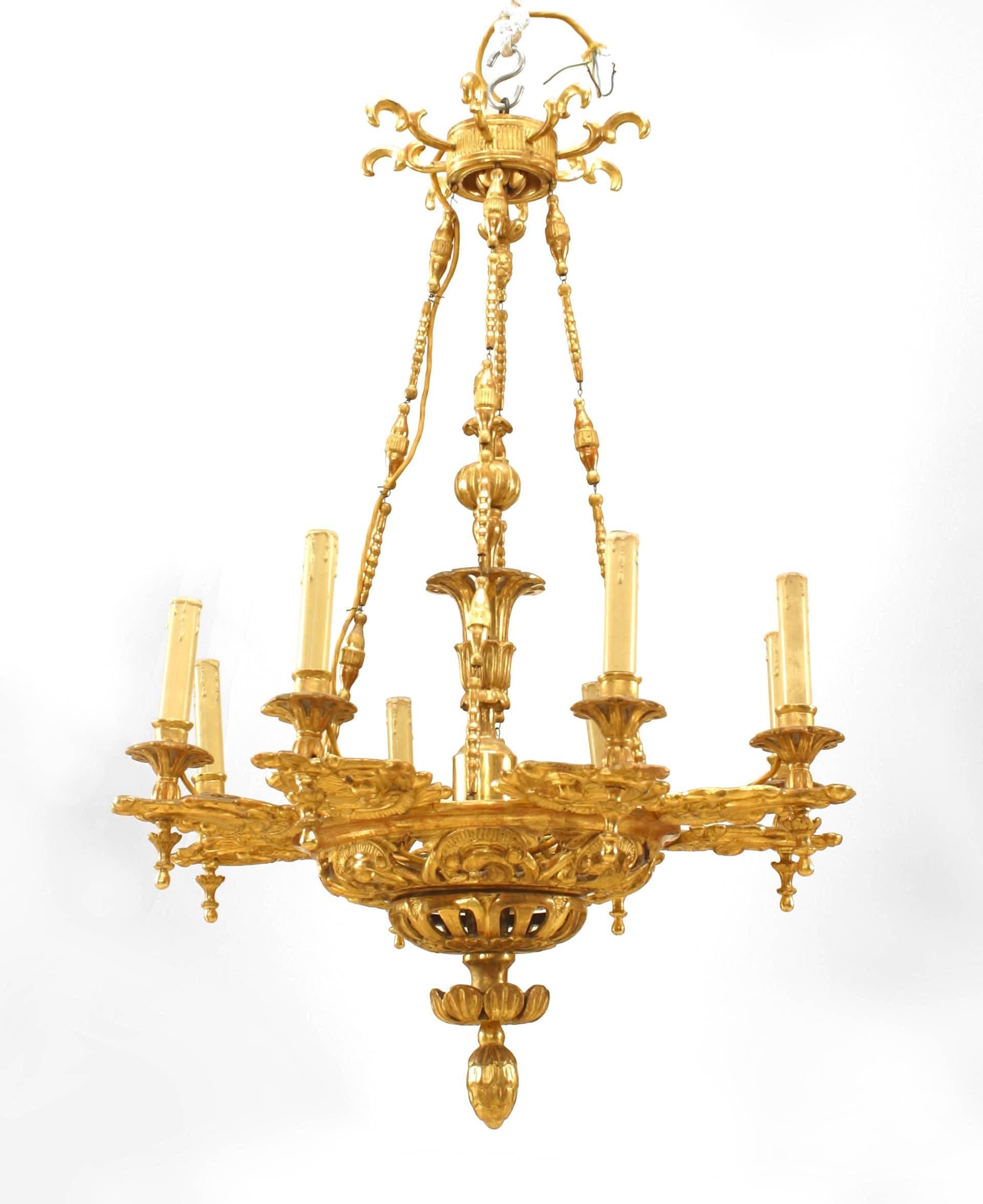 Austrian Biedermeier (Circa 1930) gilt carved chandelier with 8 filigree carved arms & bottom with finial and 8 scroll carvings on canopy

