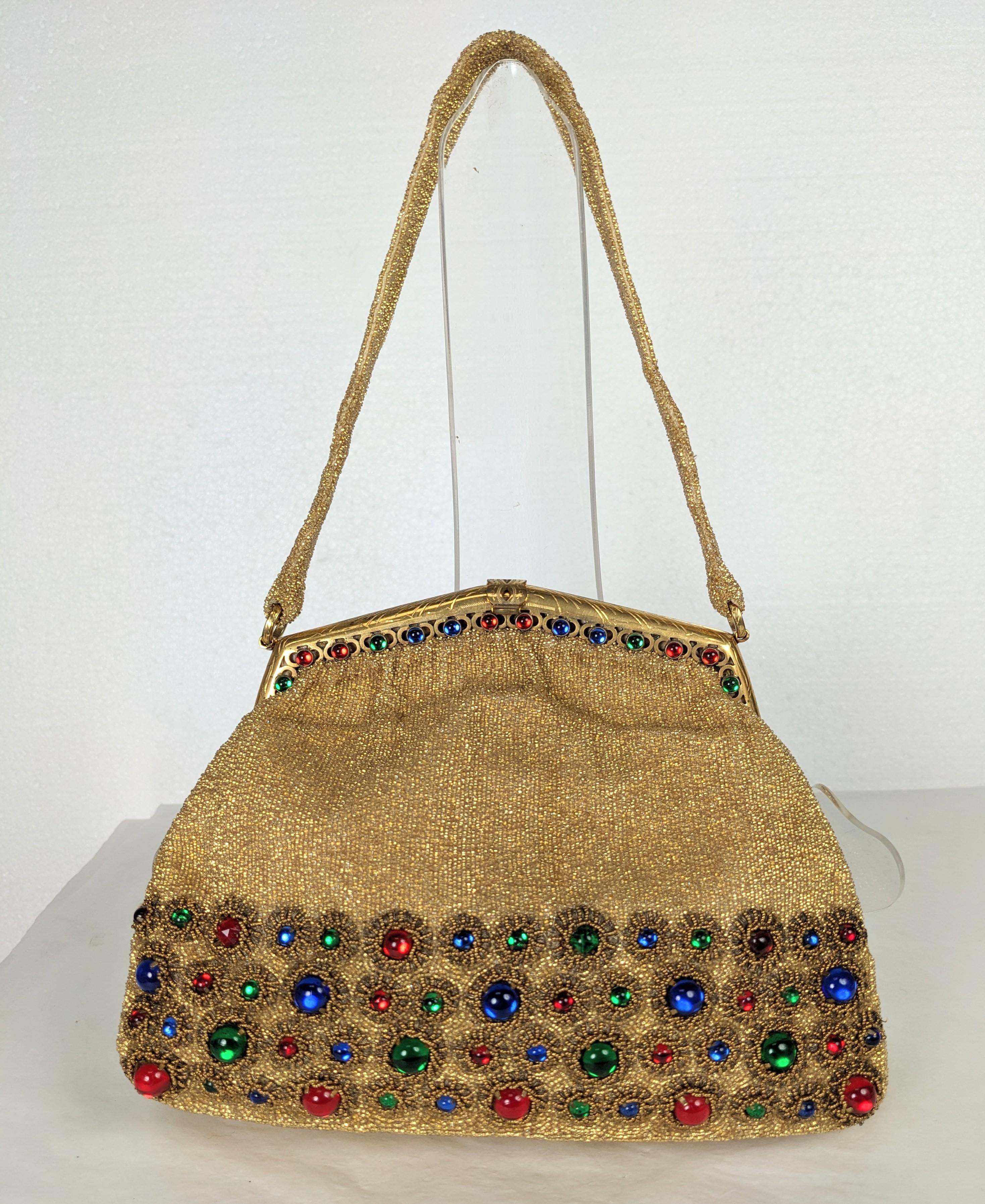 Elaborate Beaded French Evening Bag of gold seed beads with tri color cabochon and gilt bullion embroidery. Incredibly intensive Haute Couture quality hand embroidery with silk satin lining. Matching jeweled frame. 1950's France, retailed by Saks
