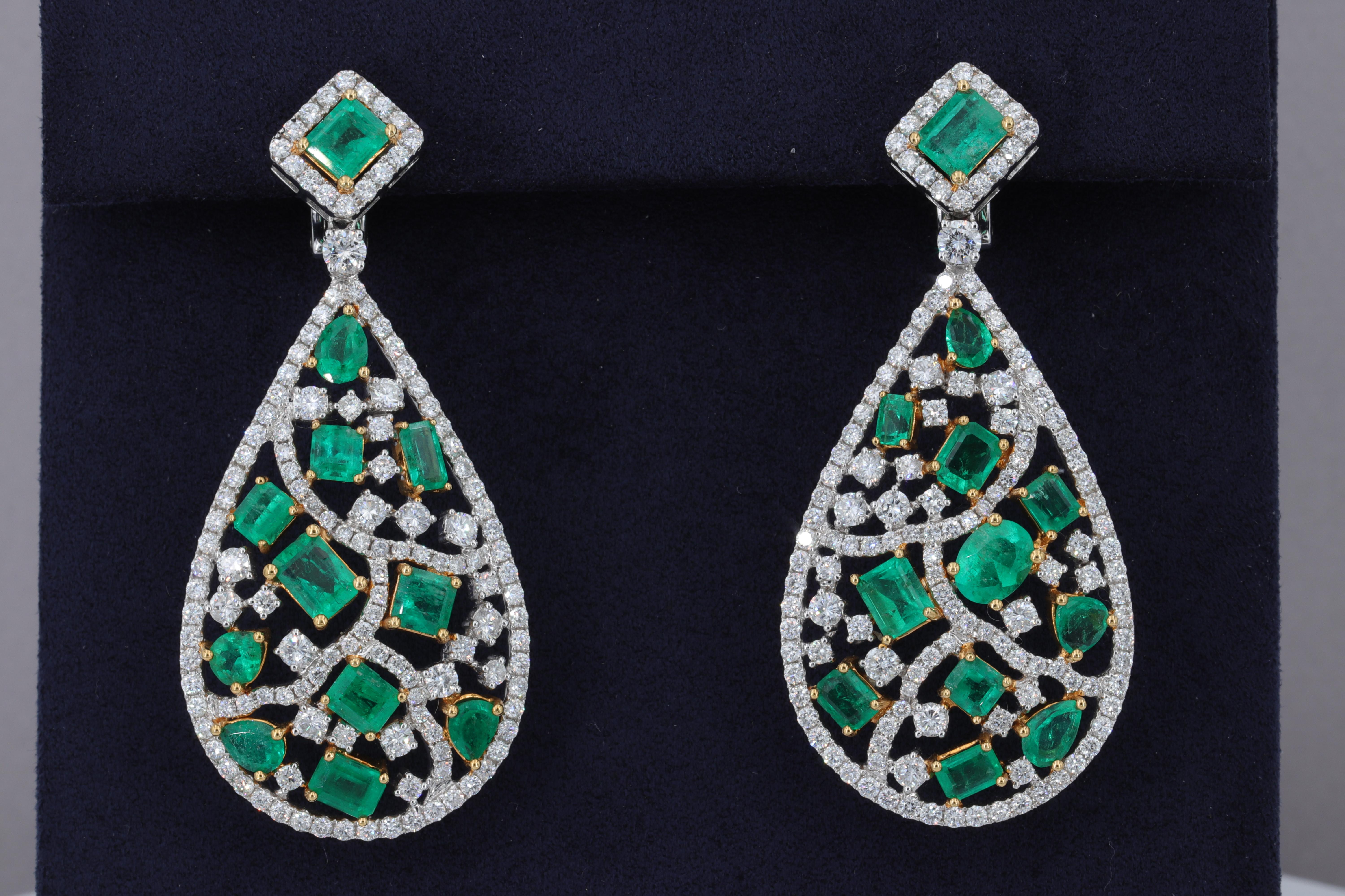 12.11 Carat Colombian Emerald and 5.08 Carat Diamond Drop Earrings

This exceptional pair of Colombian Emerald and Diamond drop earrings is set with approximately 12.11 carats of fine quality emerald cut Colombian emeralds and approximately 5.08