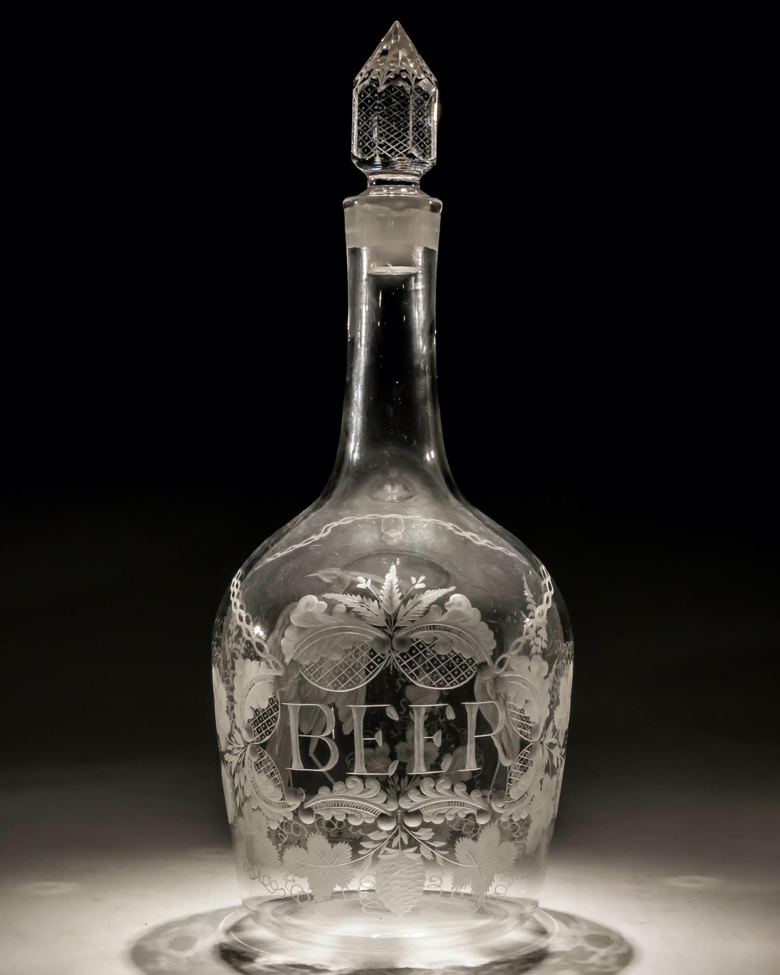 A rare Georgian decanter of shoulder form wheel engraved with a BEER cartouche surrounded with hops and vines, The reverse engraved with exotic game birds identical to those used by James Giles on his glided decanters.

The decanter holding just