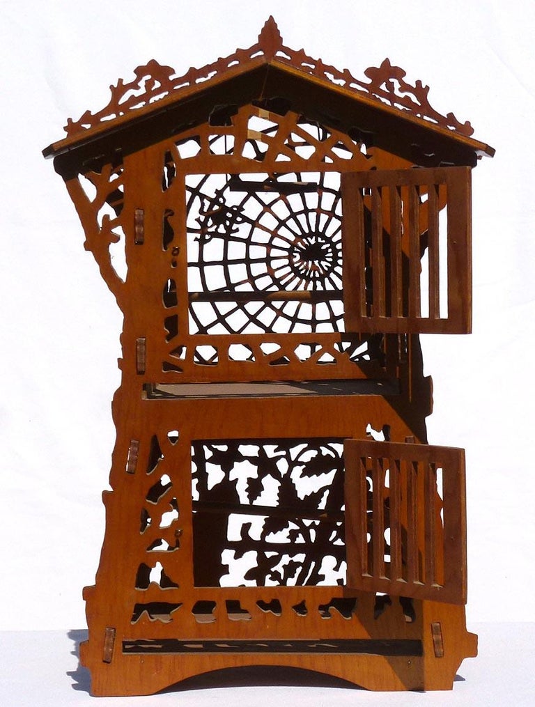 Elaborate Fretwork Bird Cage with Spider and  and a Cat Among Leaves