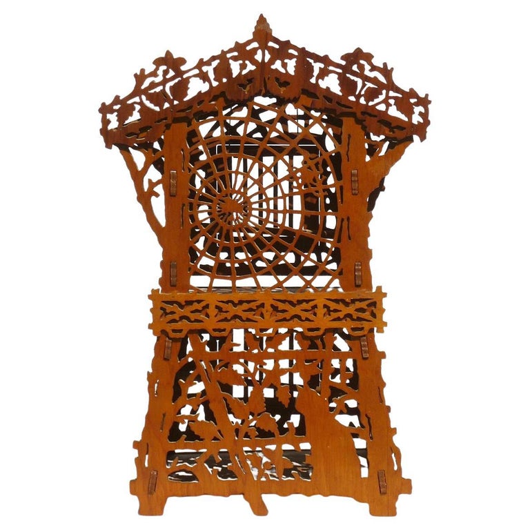 Elaborate Fretwork Bird Cage with Spider and  and a Cat Among Leaves