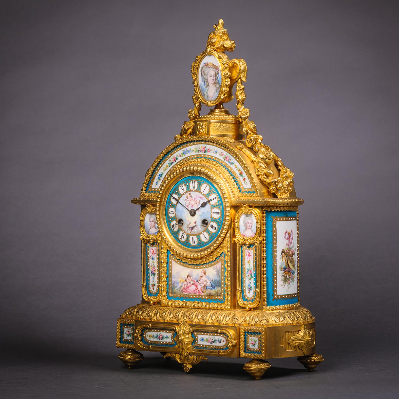 A fine and elaborate gilt bronze and Sèvres-style porcelain mantel clock.

French, circa 1870.

A fine and elaborate gilt bronze and Sèvres-style porcelain mantel clock with a four inch porcelain dial painted at the centre with a putto, and