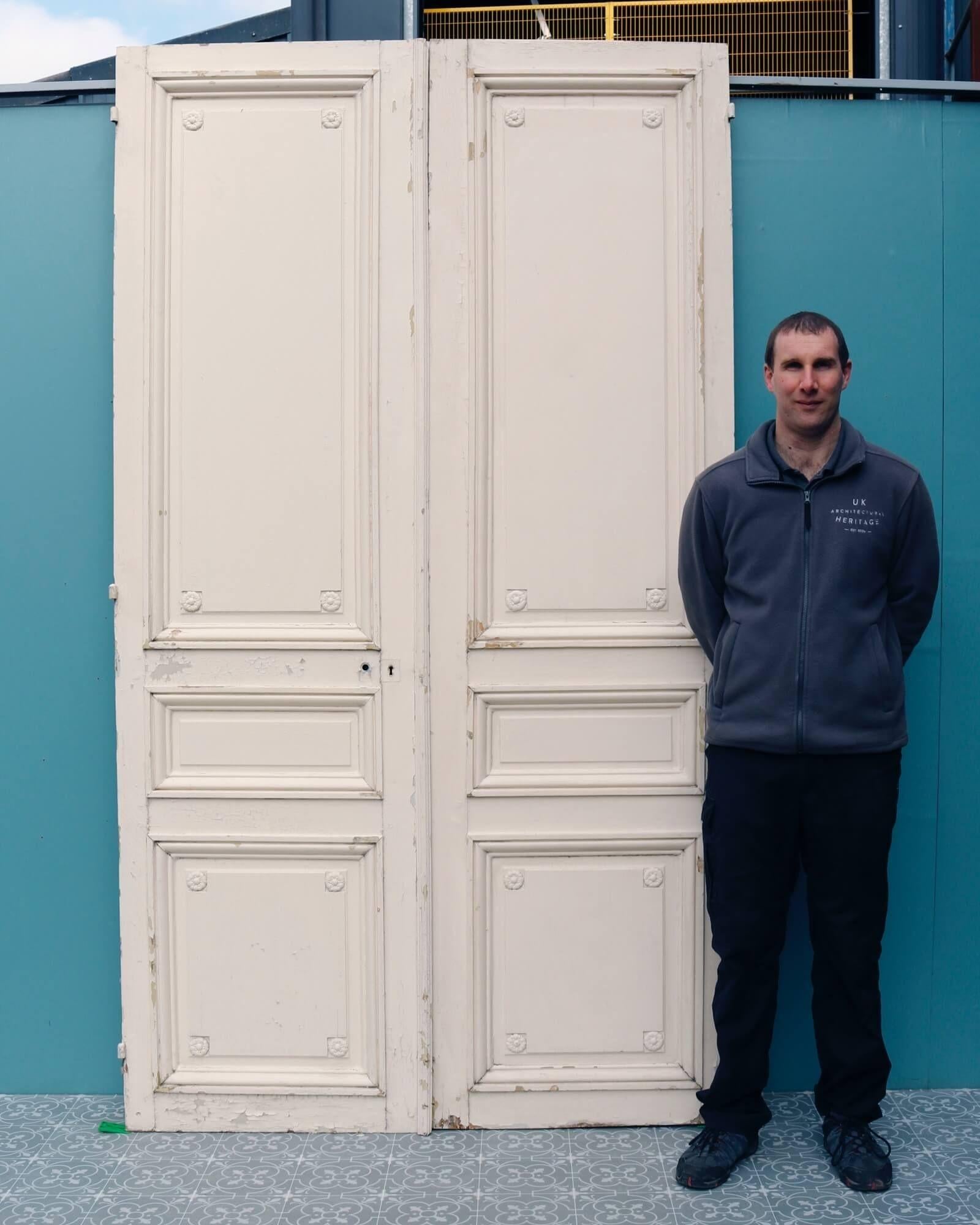 This elaborate set of tall antique Louis XVI style double doors are one of various sets reclaimed from the American Embassy in Paris.

Dating from circa 1870, these antique doors are generous in size, showcasing the grandeur and opulence of 19th