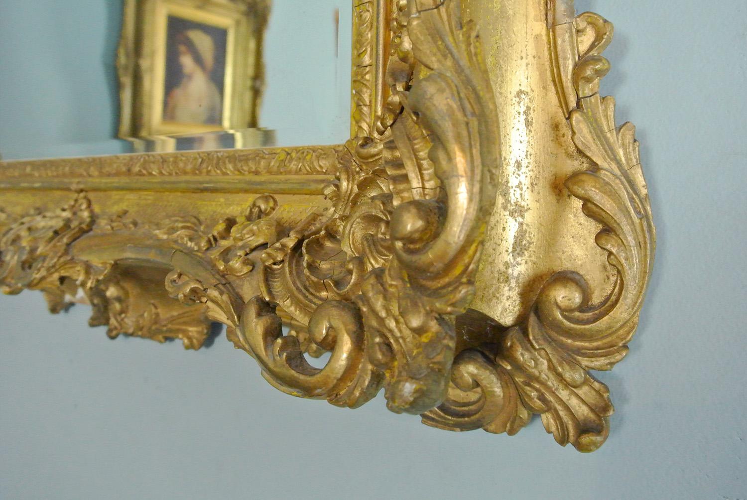 Elaborately Carved and Original Georgian Giltwood Frame with Bevelled Mirror  In Good Condition In Heathfield, GB
