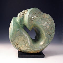 “Aqua Incision”, blue green circular ceramic, carved with flowing water lines