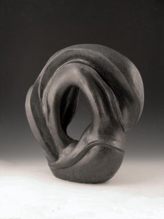 "Around About”, ceramic sculpture of swirling forms in gun metal black glaze
