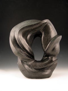 "Around About”, ceramic sculpture of swirling forms in gun metal black glaze