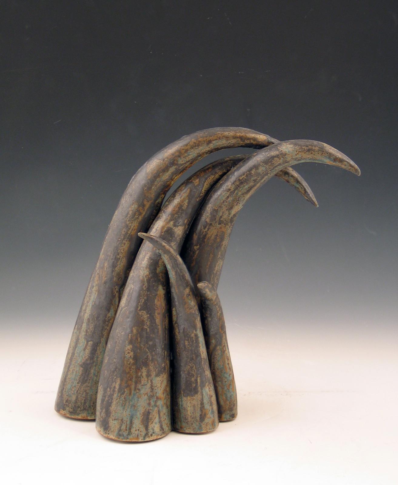 Elaine Lorenz Abstract Sculpture - “Moving On”, sheaf of curved ceramic forms in deep browns