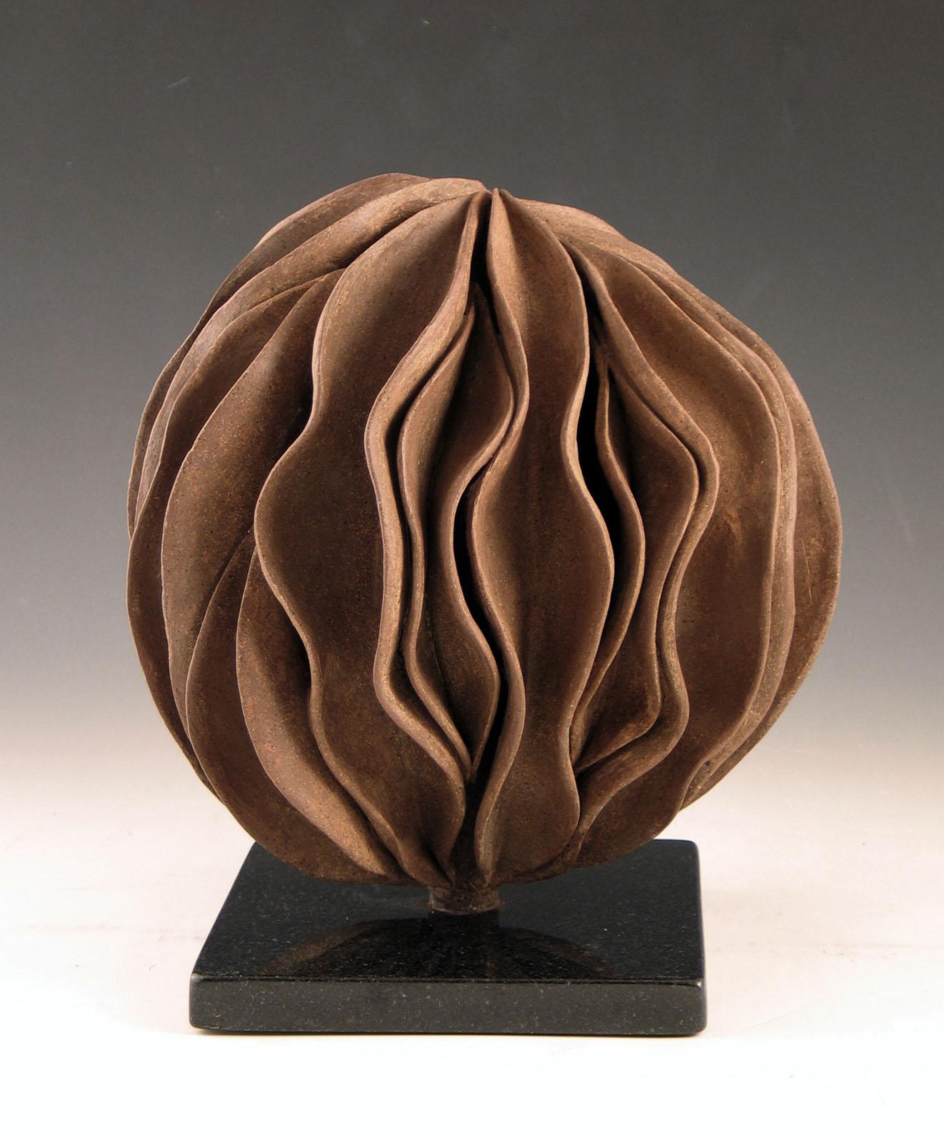 Elaine Lorenz Abstract Sculpture - “Revolver”, wavy shell swirls in rich browns
