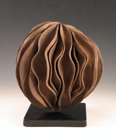 “Revolver”, wavy shell swirls in rich browns