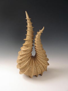  “Upon Itself” radiates fins spiraling around a tapering coiled ceramic form. 