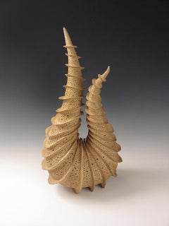 Elaine Lorenz - “Upon Itself” radiates fins spiraling around a tapering coiled ceramic form. “Upon Itself” radiates fins spiraling around a tapering coiled ceramic form.