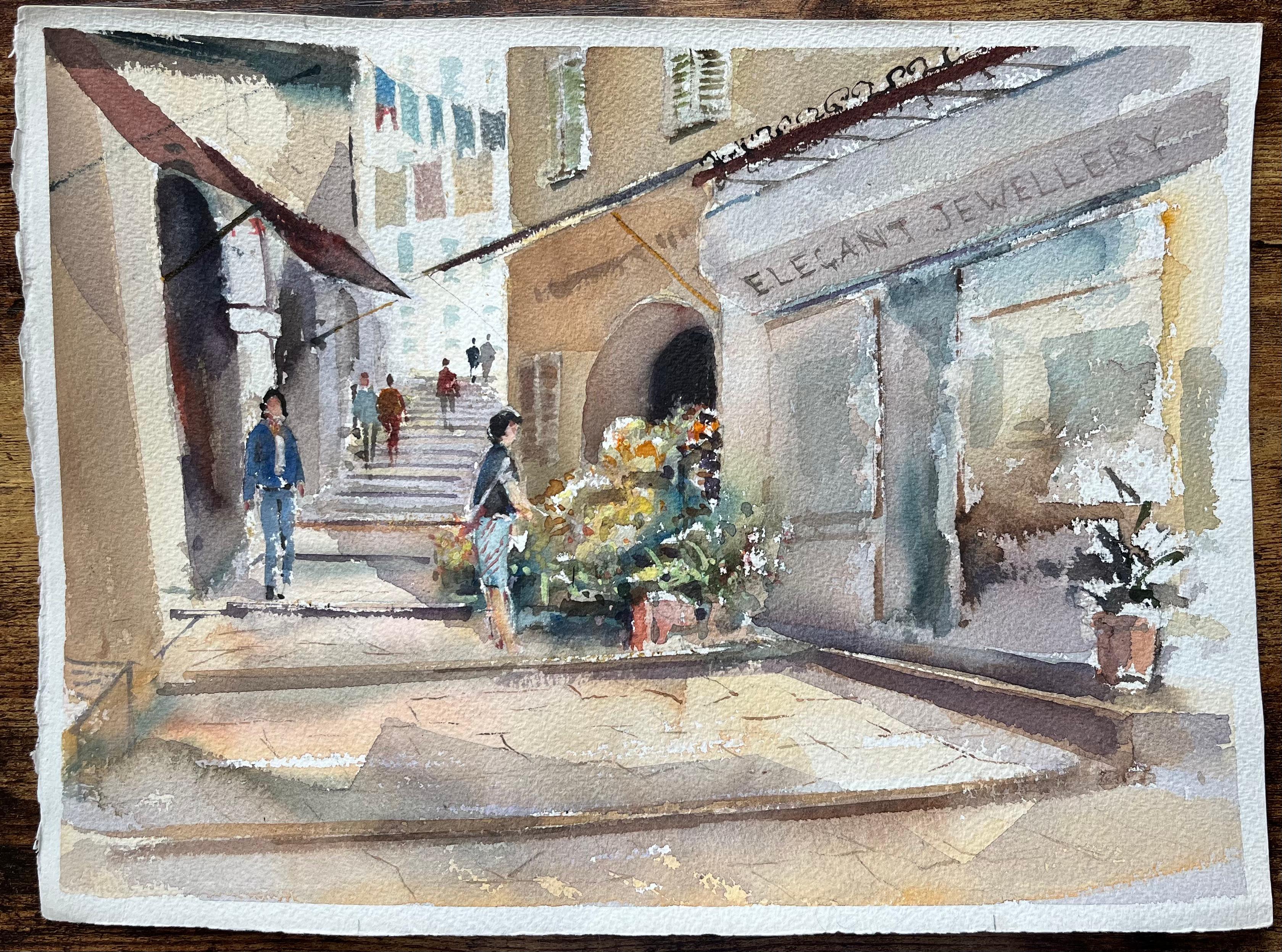 Acuarela original de una escena callejera mediterránea iluminada por el sol con puestos de flores - Painting de Elaine Mucklow