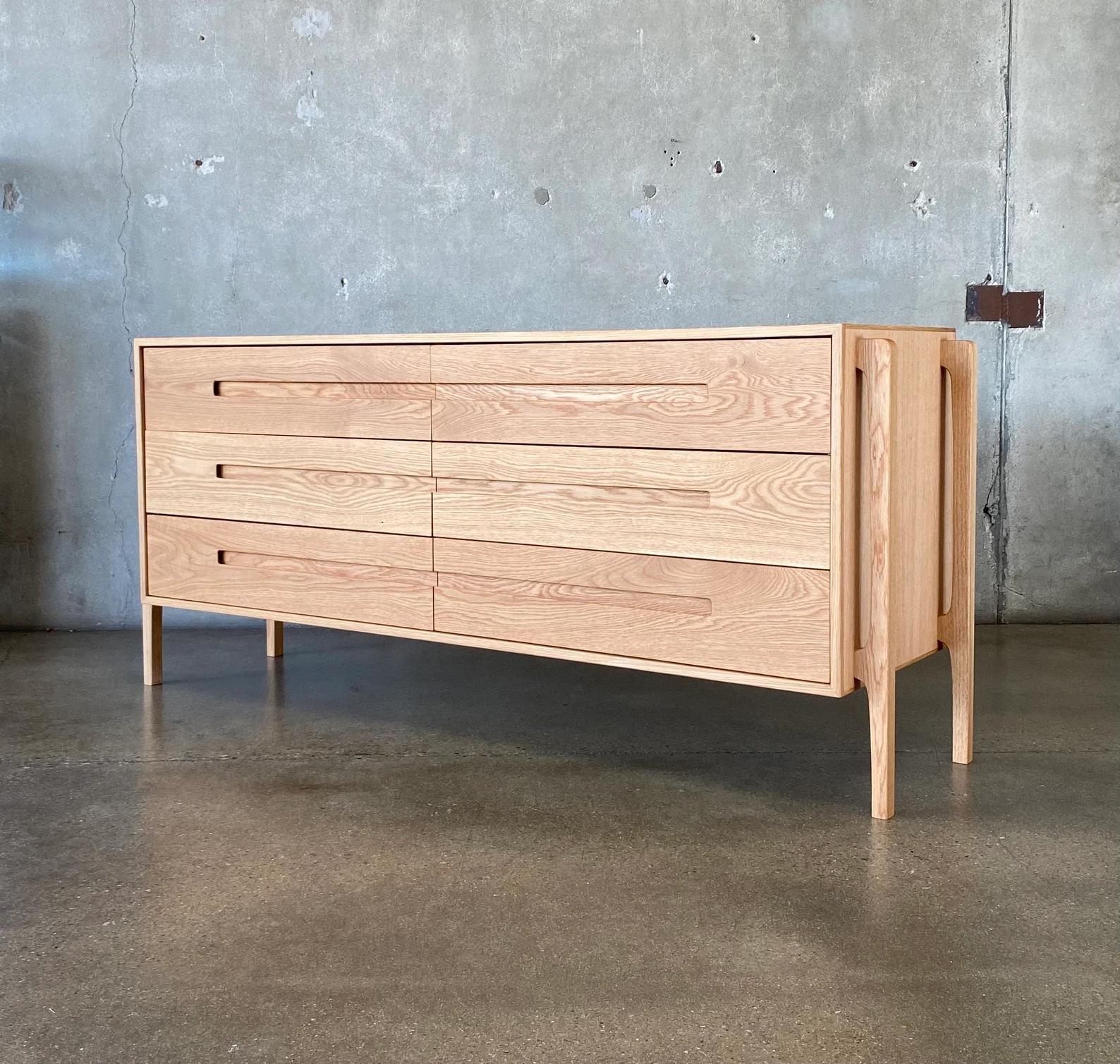 This lowboy dresser is an original Deeble design, with a strong Scandinavian/Danish Modern influence. The dresser pictured is in white oak, but it's available in any other species (i.e. walnut, cherry, mahogany, etc.).

The drawers are