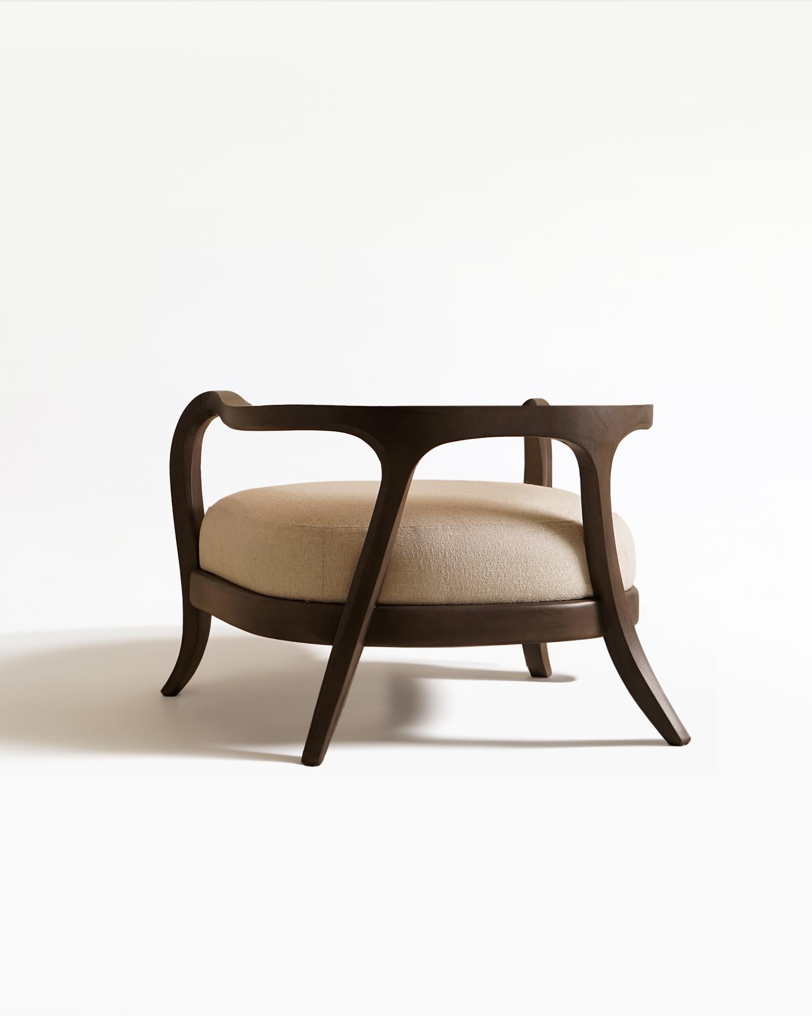 Drawing inspiration from mid-century aesthetics, our Eland lounge chair brings a fresh focal point to any living space with its striking curved details. The distinctive curved legs add an organic geometric charm, while the firm cushion offers