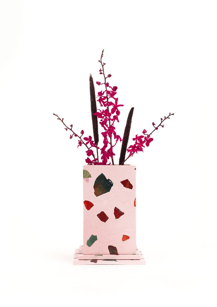 An architectural element for your floral arrangement, Elara is a flamingo pink colorway featuring Red Jasper, Carnelian, Green Jasper, Bloodstone, Green Amethyst and Malachite. Each vase is cast in our proprietary gemstone terrazzo material and