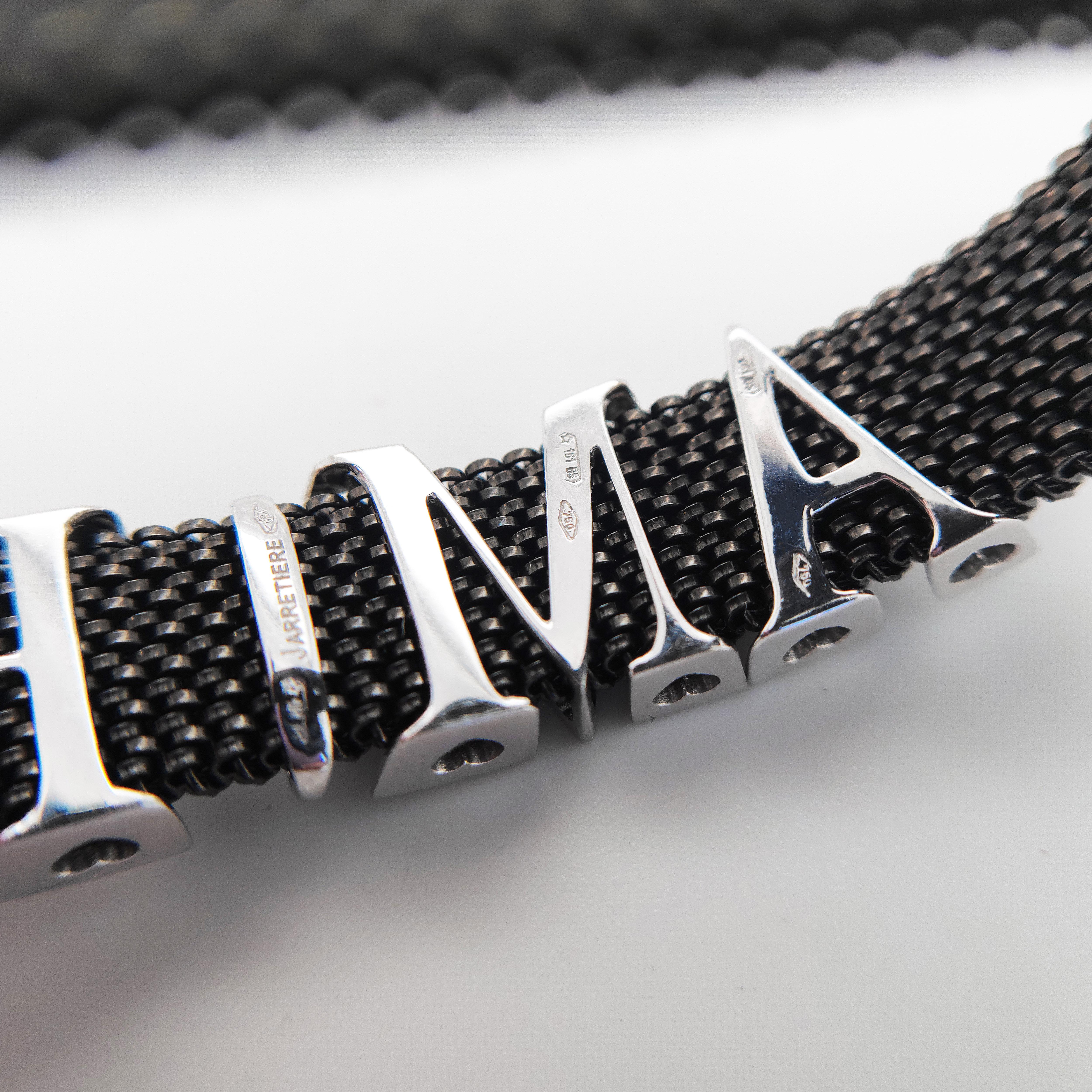 Elastic Armband aus schwarzem Stahl und Amore-Gold mit Buchstaben und Diamanten (Brillantschliff) im Angebot