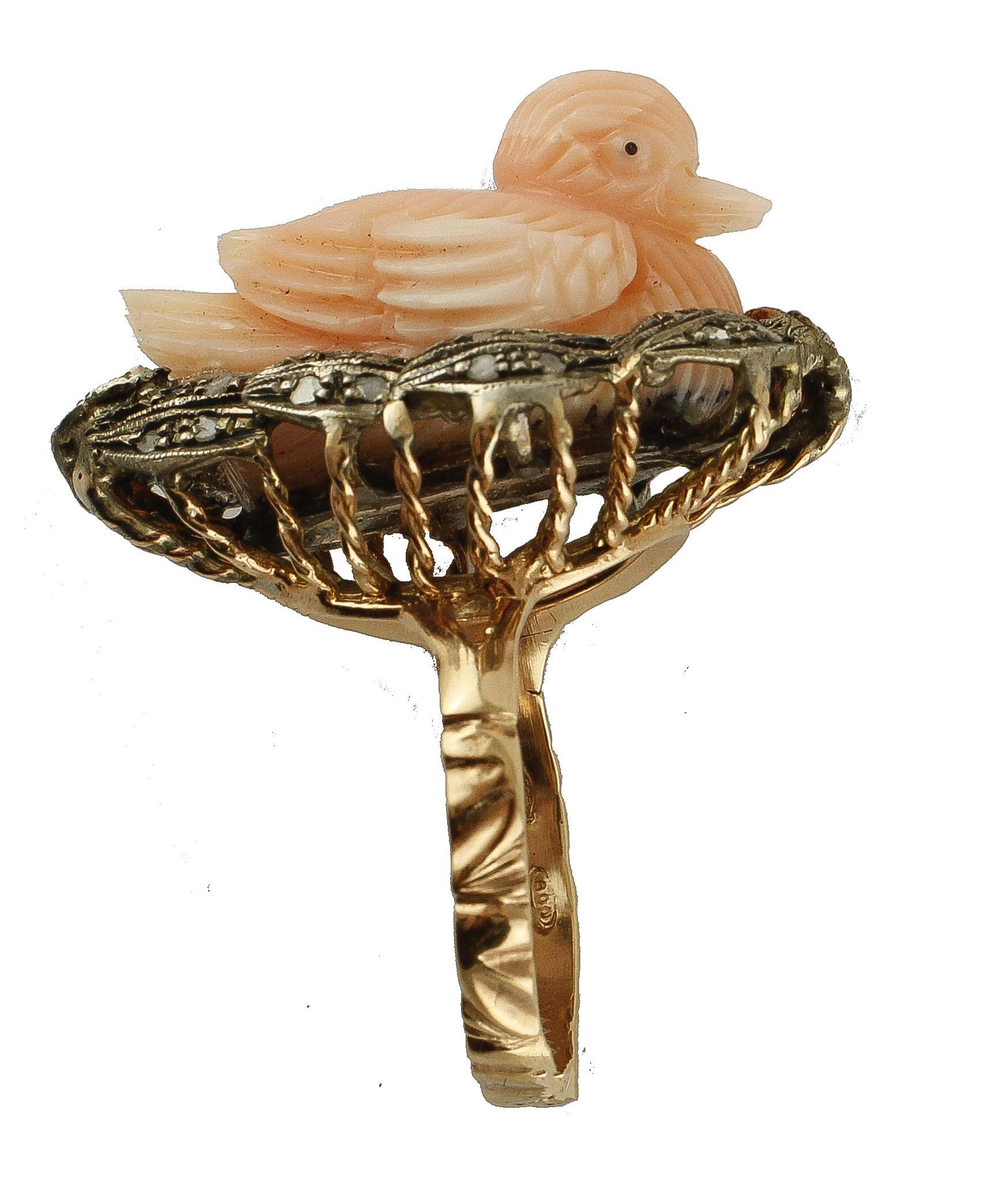 Lovely ring in 9k rose gold and silver structure, mounted with a sweet elatius carved coral duck in the centre surrounded by leaves in silver studded with diamonds. 
This ring is totally handmade by Italian master goldsmiths
Diamonds 0.31 ct
Elatius