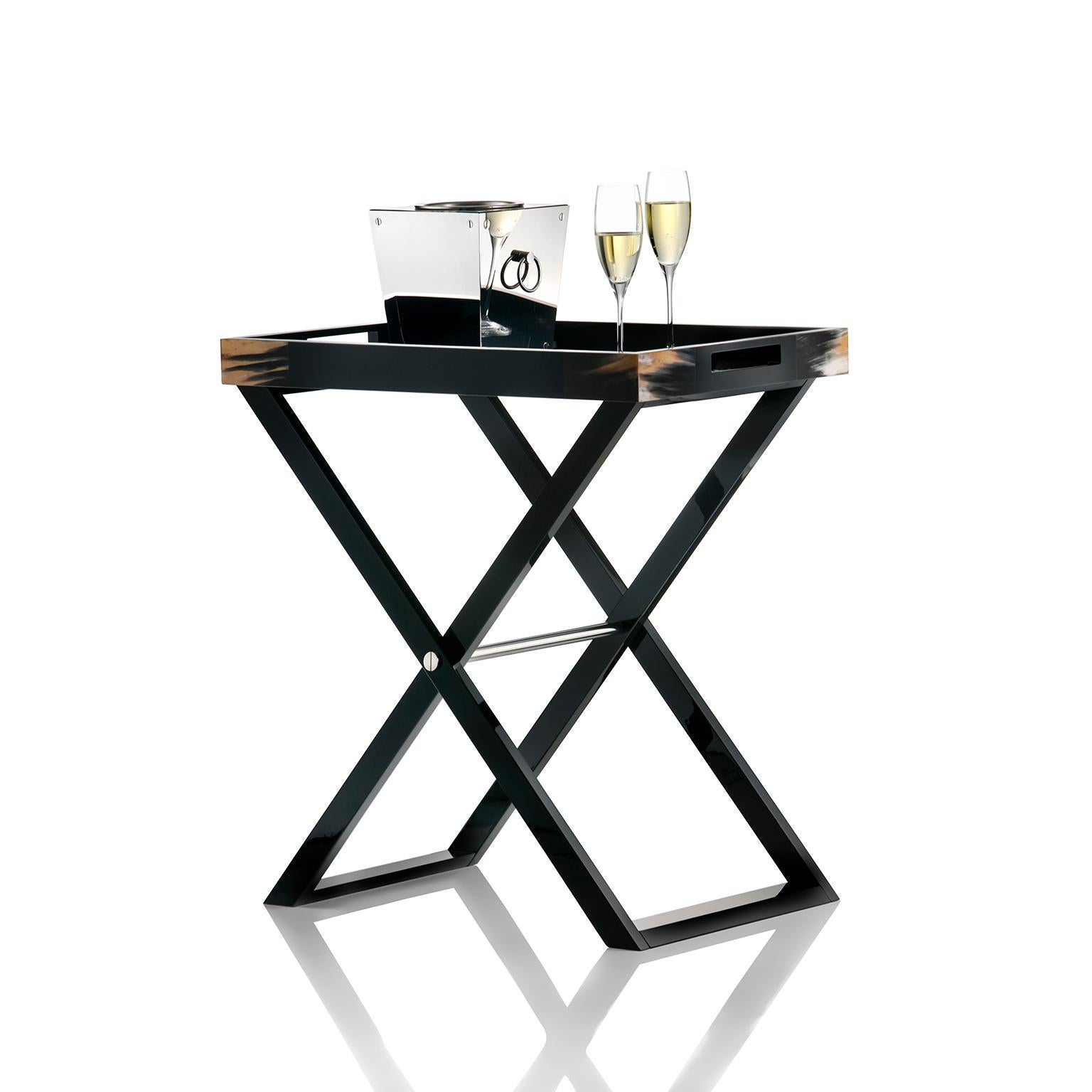 Beautiful texture and elegant appeal make our Elba butlers serving table a stunning addition to a contemporary interior. Unique accents in Corno Italiano bring a truly individual touch to the structure crafted of polished black lacquered wood, with