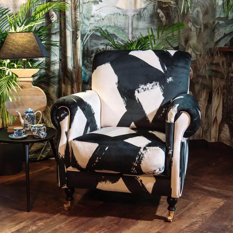 Elbrus Dreamscape Armchair
Step into the world of luxury with our Elbrus Dreamscape Armchair, adorned with super soft velvet upholstery. The design showcases an eclectic mix of black and white, exuding a sense of grandeur and elegance that