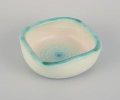 Elchinger, France. Two ceramic bowls with light-toned glaze.