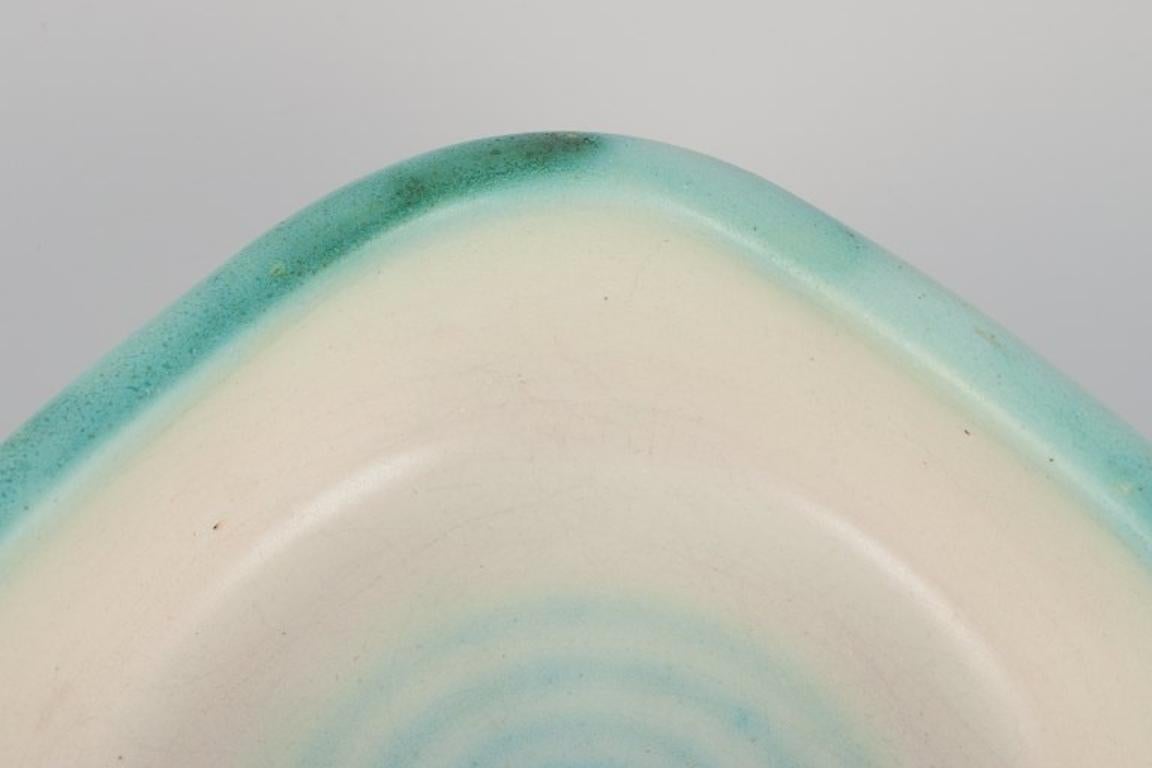 Mid-20th Century Elchinger, France. Two ceramic bowls with light-toned glaze.  For Sale