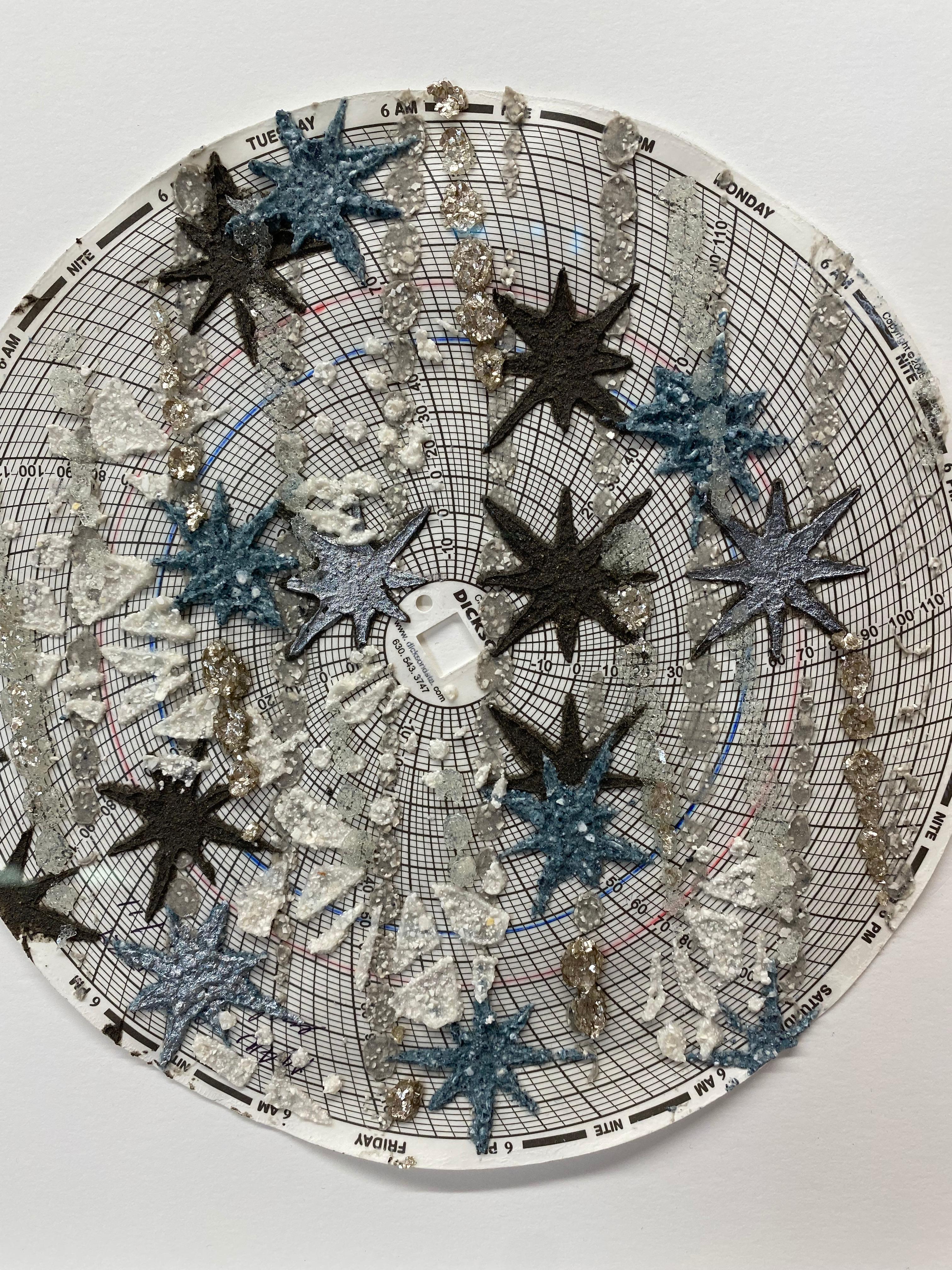 Carefully applied layers of emu eggshell, wood ash, glass beads, mica on hygrothermograph paper create surface texture in this mandala made up of intricate patterns, blue and dark charcoal gray stars layered over radiating circles in silver. 8