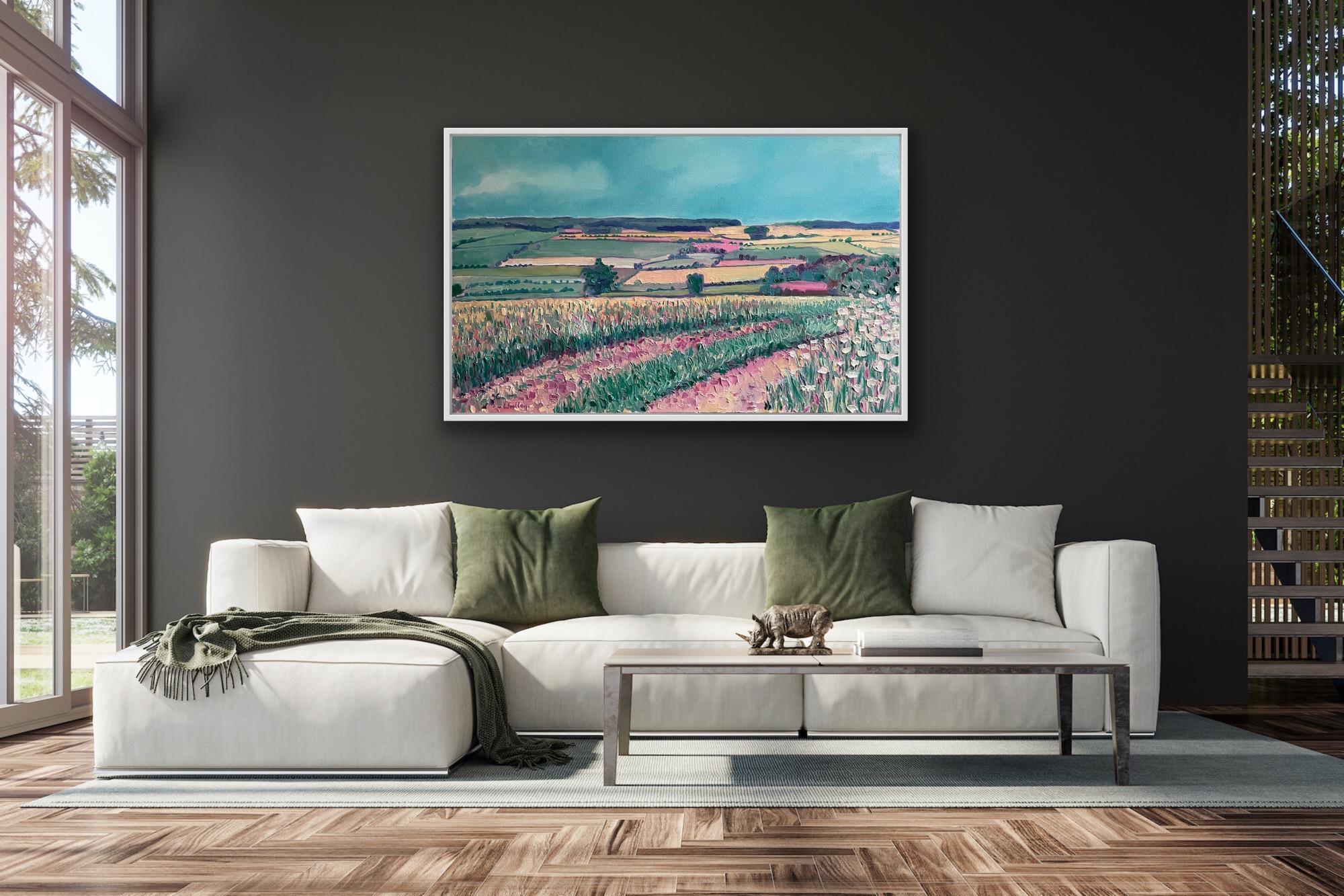 Chadlington is an Original oil painting by Eleanor Woolley. This painting was started Plein air and finished in the studio. Painted sketches of the area were made for reference. A pink earth track leads our eyes into the painting. The long grass in