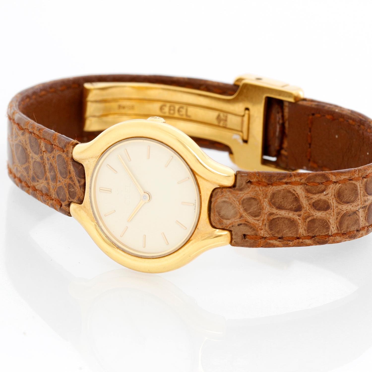 Ebel Beluga 18K Yellow Gold Ladies Watch 866960 - Quartz. 18K Yellow gold ( 24 mm ). Beige Matte with stick hour markers. Crocodile brown with 18K Yellow gold deployant clasp. Pre-owned with Ebel box. 