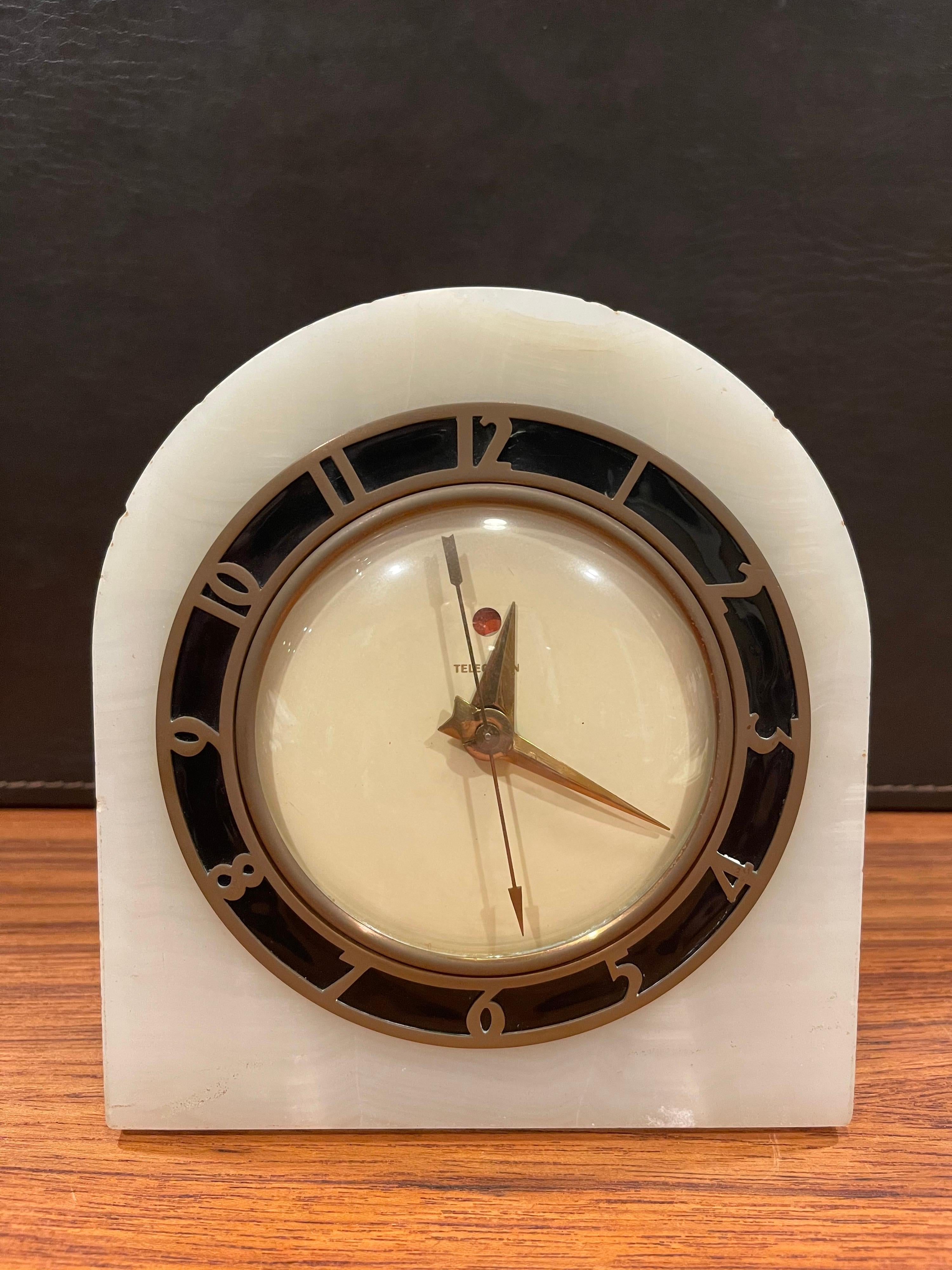 Beautiful electric Art Deco white onyx mantle clock known as the 