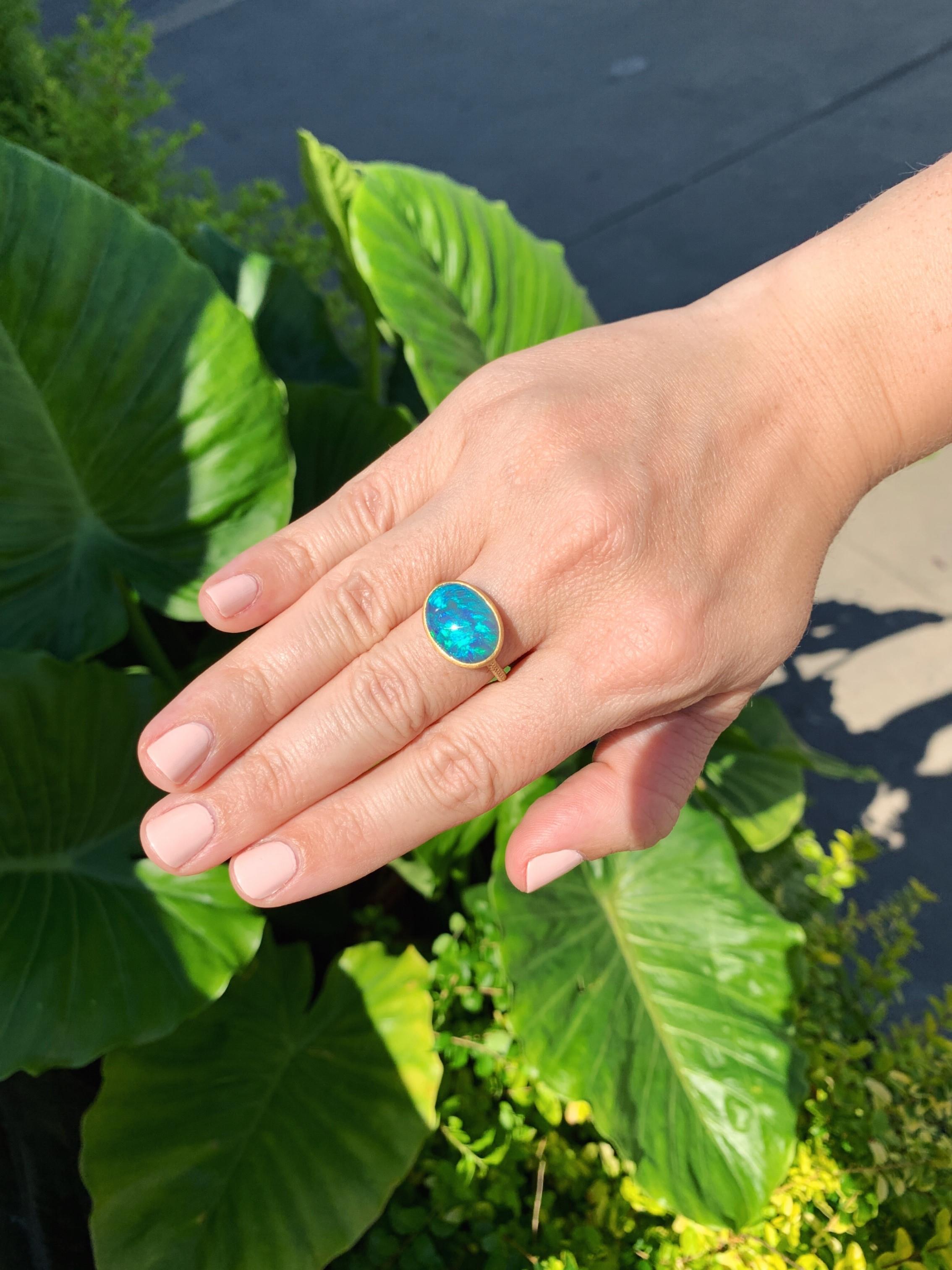 One of a Kind Editions Ring hand-fabricated in Japan by jewelry designer Shinobu Marotta (Talkative Atelier) showcasing a phenomenal, electrifying 7.54 carat black opal from the renowned Lightning Ridge mine in Australia, framed and bezel-set in