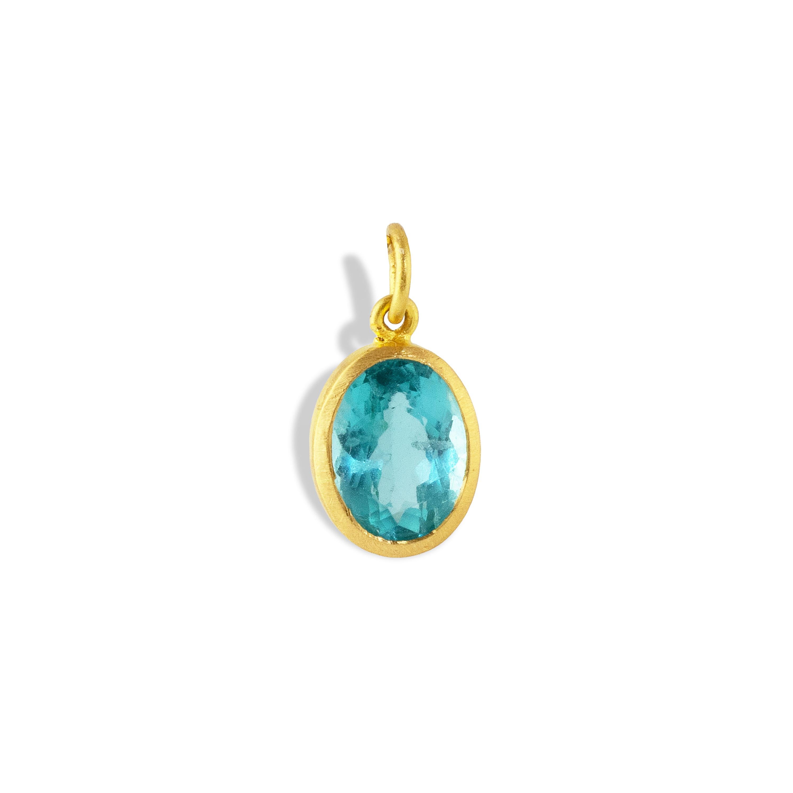 An electrifying shade of neon  greenish-blue apatite similar to the famous Paraiba Tourmaline is bewitching in a simple 22k matte yellow gold setting.  Perfect to wear alone or pair with other gems. 

 Apatite is a gemstone of manifestation as it