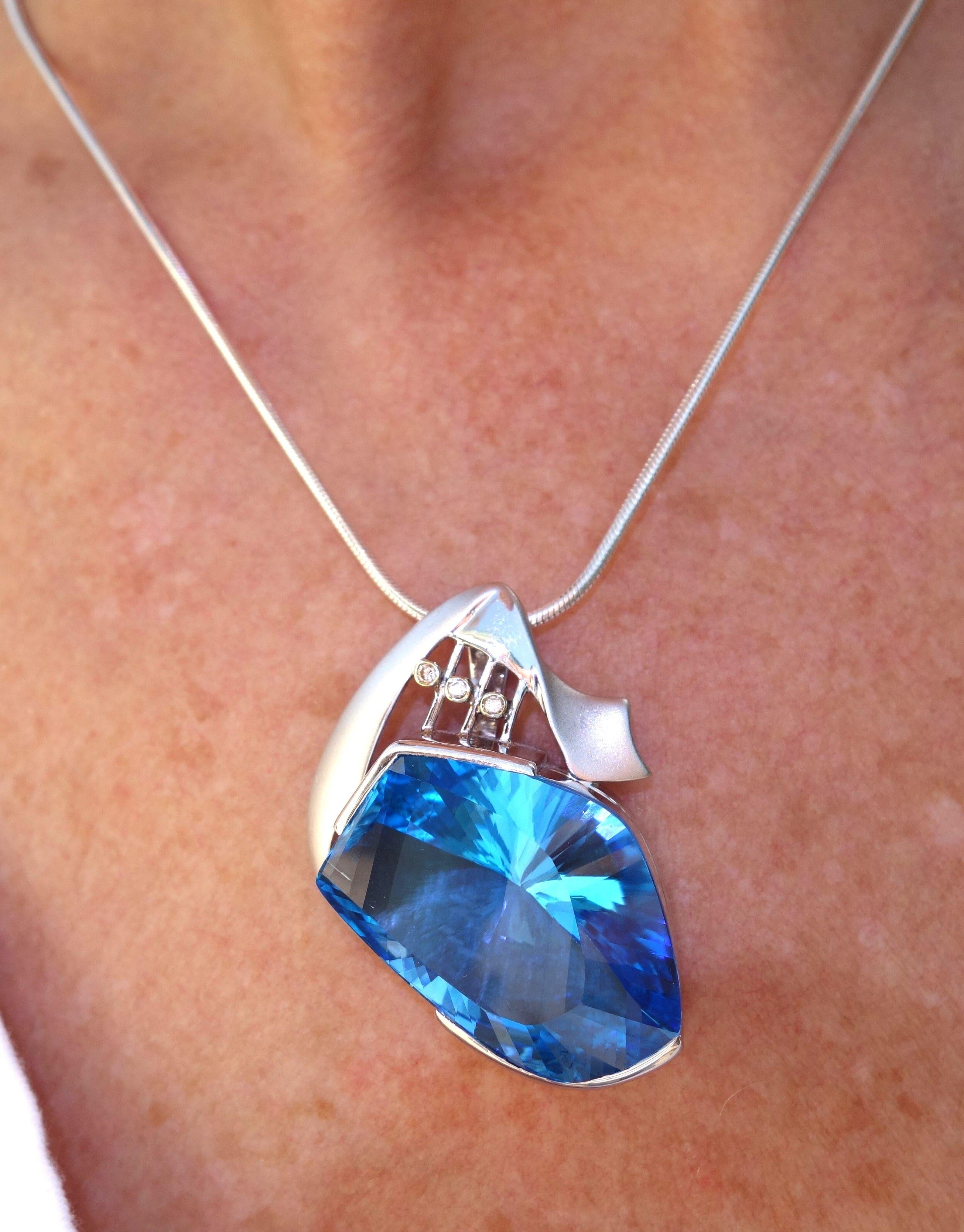 Modern Electric Blue Topaz and Diamond Gold and Sterling Silver Pendant Necklace For Sale