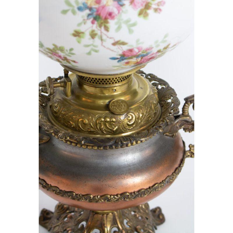 Ornate victorian oil lamp. Coppered steel and cast brass. Original glass shade with cupid and flowers

Material: Brass,Glass
Style: Traditional, Victorian
Place of Origin: United States
Period made: Late 19th Century
Dimensions: 11 × 11 × 24