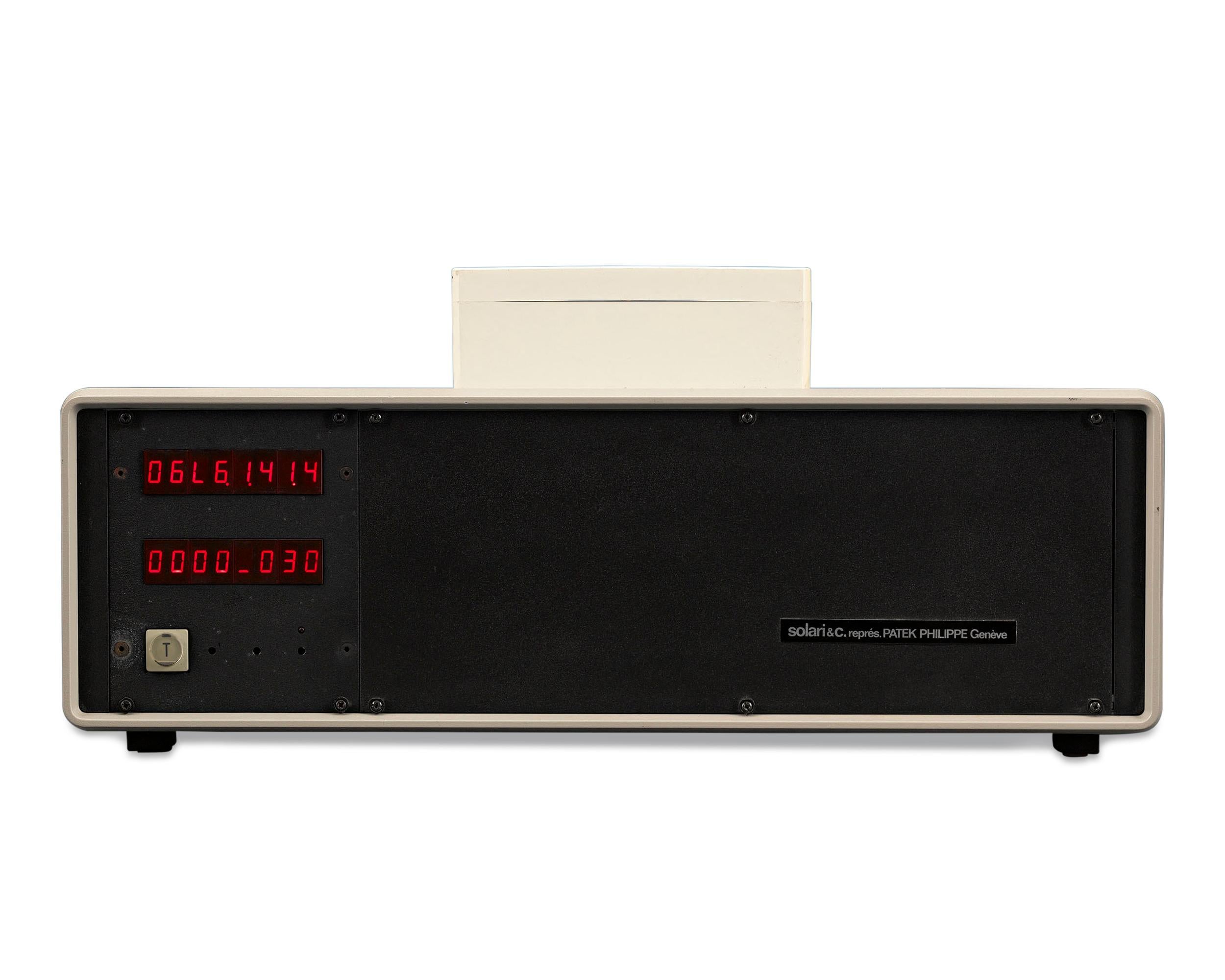 This exceptionally rare early electronic clock and aerial is part of the Electronic Master Clock System by Patek Philippe of Geneva. Remarkably sophisticated and technologically advanced in its day, the unit is set to display and record the exact