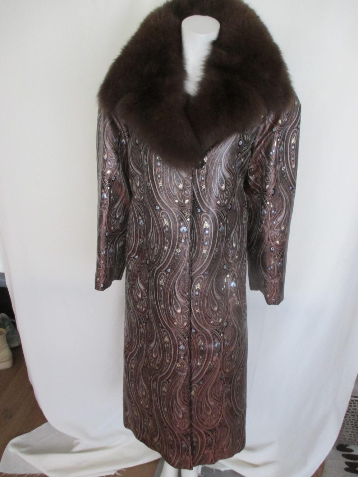 A long evening or opera coat with Siberian brown fox collar, made of
silk velvet/leather feeling fabric embossed with Art Deco stylised floral motifs and glitter. 

We offer more luxury fur and vintage items, view our frontstore.

Details:
With 2