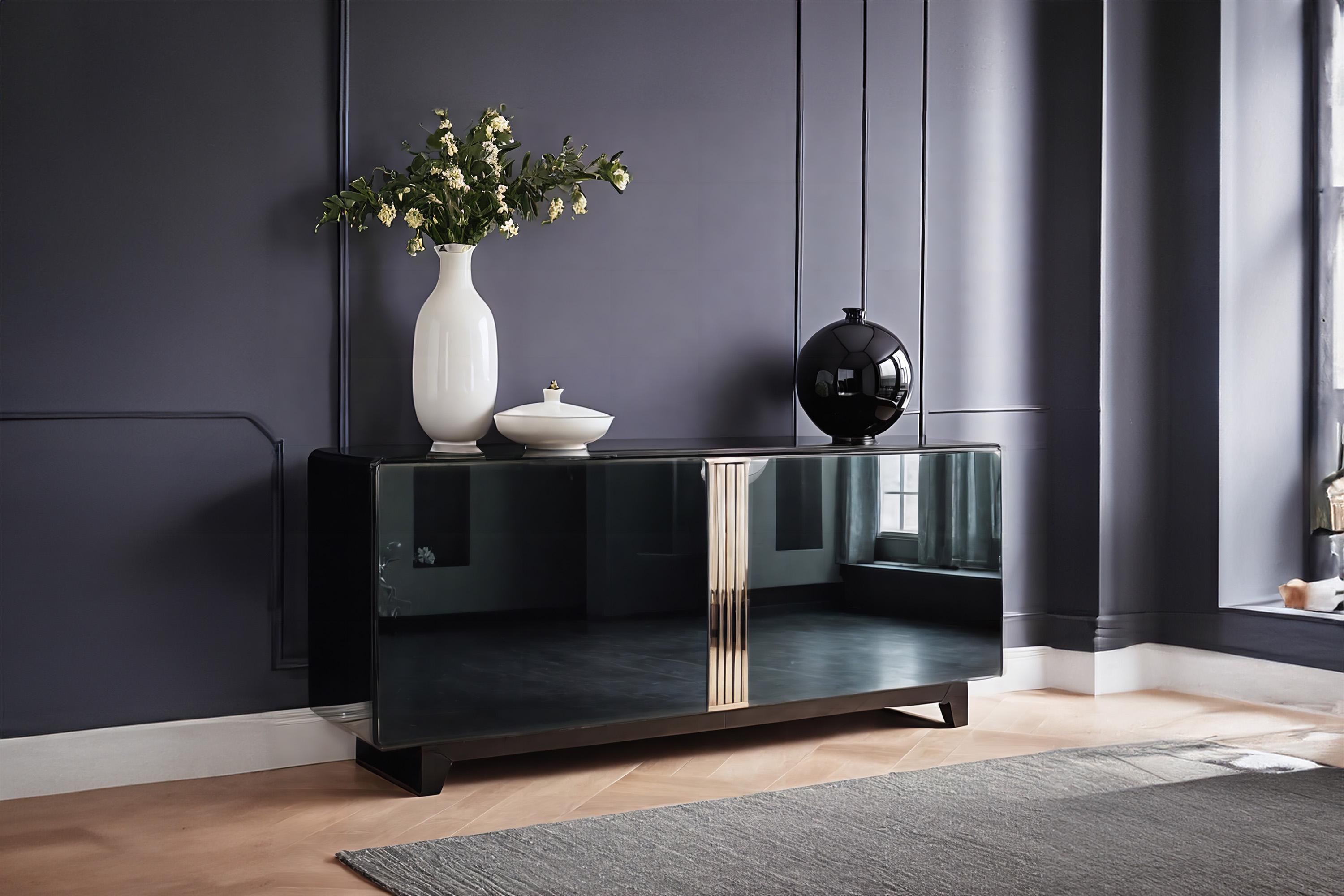 Experience timeless elegance and minimalist chic with our Art Deco sideboard. Finished with a flawless high-gloss piano lacquer, this piece of furniture captivates attention and brings a touch of luxury into your home. The polished stainless steel