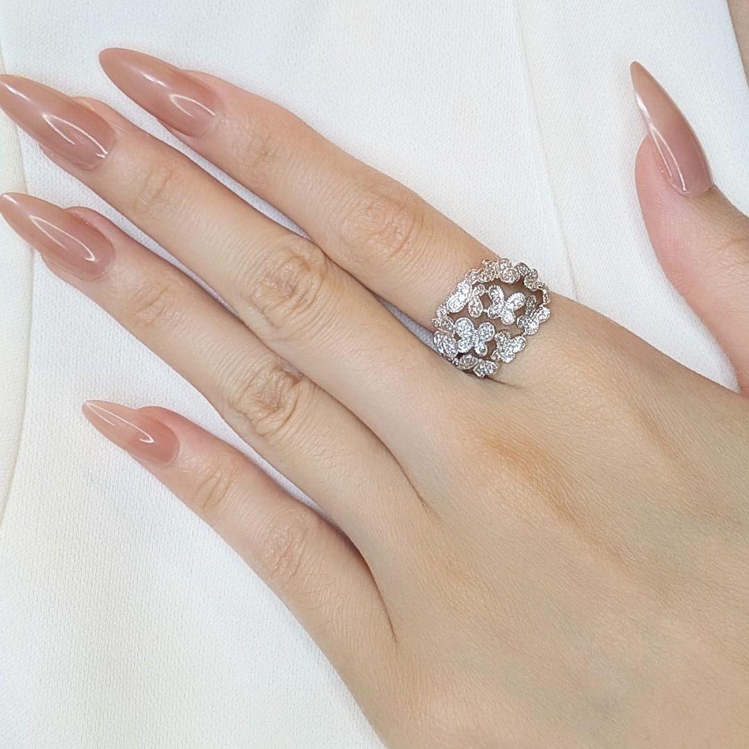 Add a touch of brilliance to your jewelry collection with this sophisticated 0.27ct diamond ring, expertly crafted in luxurious 18K white gold. Featuring 55 natural round brilliant diamonds with an H color grade and VS-SI clarity, this stunning