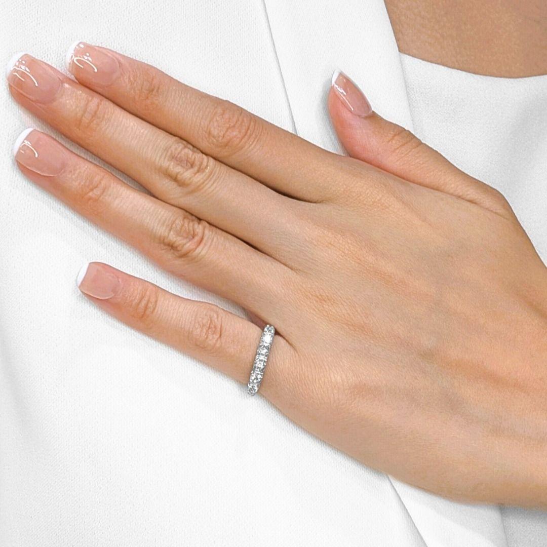 Embrace timeless allure with this exquisite, unworn vintage half-eternity ring, meticulously crafted in radiant 18K white gold. Thirty dazzling natural round brilliant diamonds, totaling a brilliant 0.30ct, are meticulously set along the band,