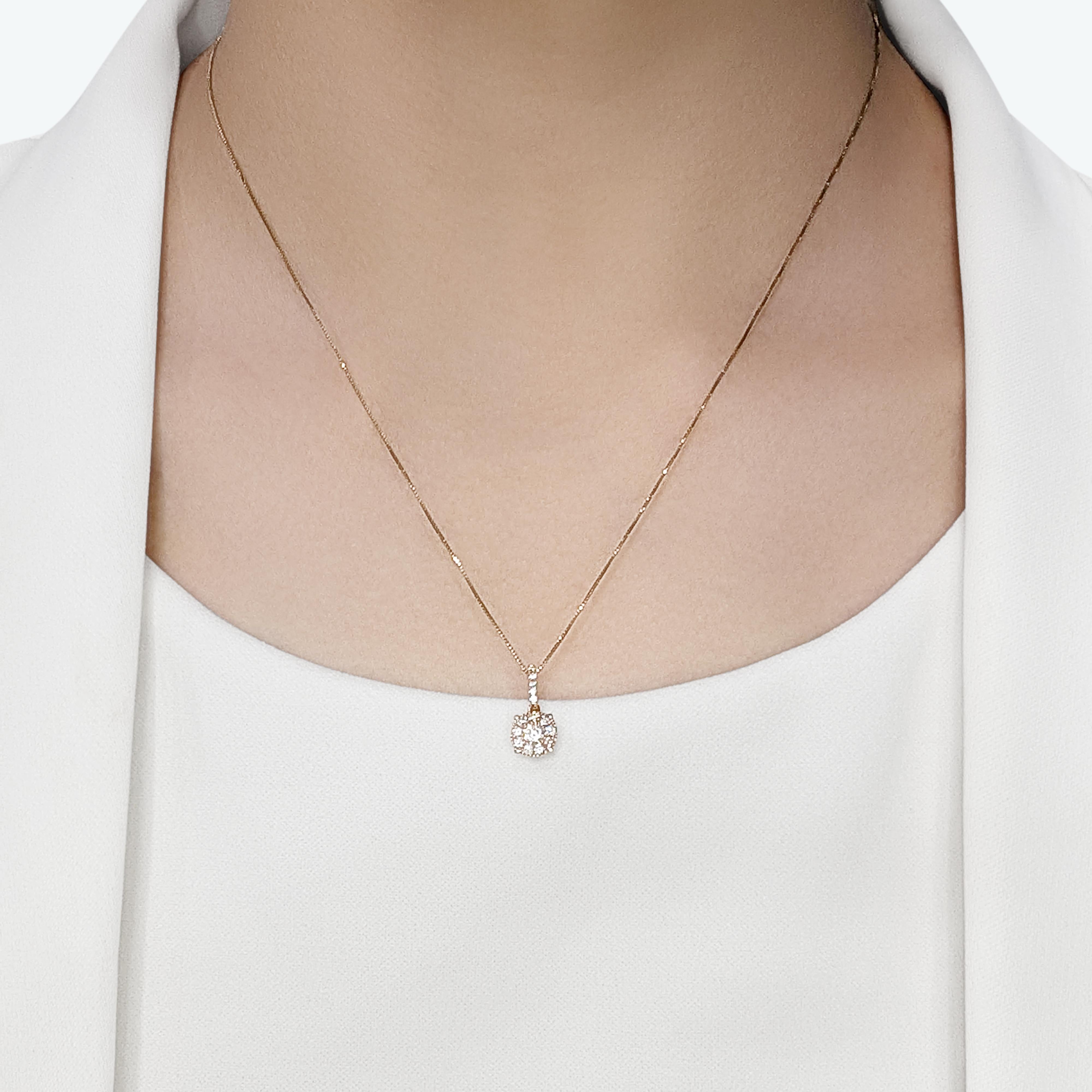 This pre-owned pendant exudes grace and understated beauty, crafted in luxurious 18K rose gold. It features a stunning centerpiece: a 0.17ct round brilliant natural diamond, graded F-G for color and VS for clarity, radiating captivating brilliance.