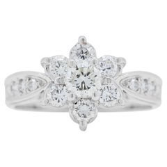 Élégante bague en forme de fleur en or blanc 18 carats et diamants 0,56 carat