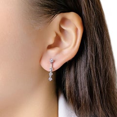 Elegant 0.58ct Celestial Diamond Drop Earrings in 18K White Gold