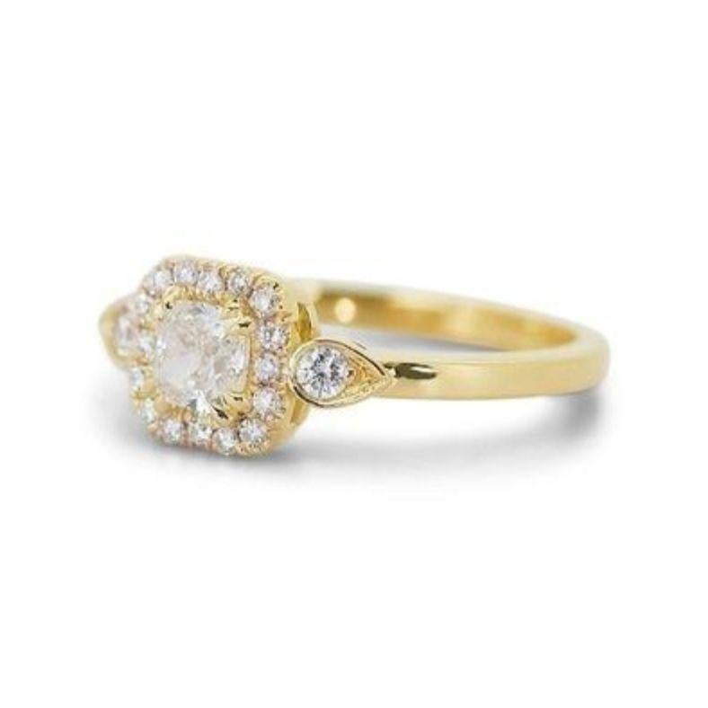 Embrace sophisticated style with a touch of modern flair with this captivating ring, featuring a dazzling 0.7-carat cushion modified brilliant diamond. This unique centerpiece, boasting the coveted I color (near colorless) and VVS1 clarity (very,