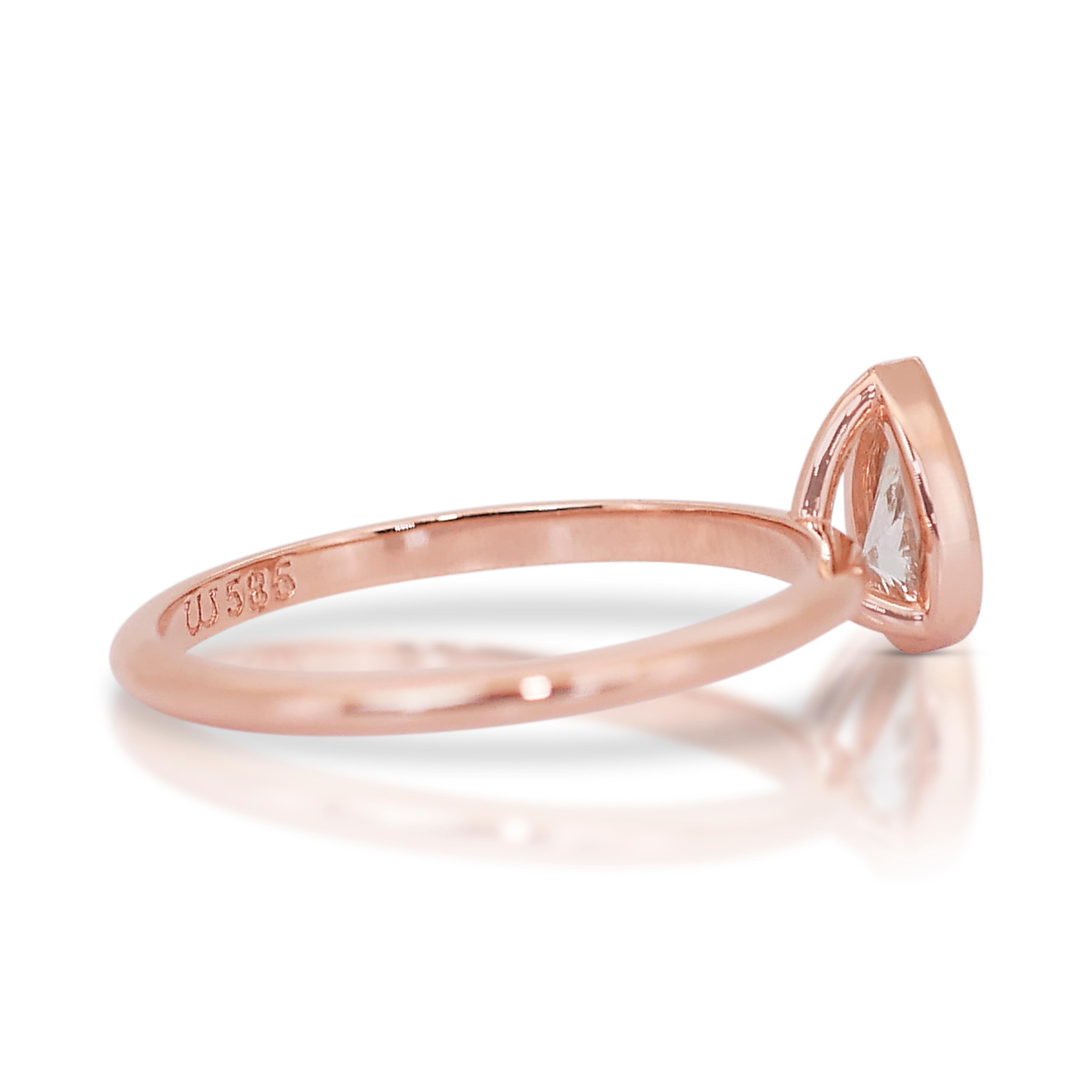 Eleganter 0,70ct Double Excellent Ideal Cut Diamant Solitär Ring in 14k Rose Gold - GIA zertifiziert

Dieser elegante Diamantring aus 14-karätigem Roségold präsentiert einen atemberaubenden 0,70-Karat-Diamanten im Birnenschliff mit doppeltem