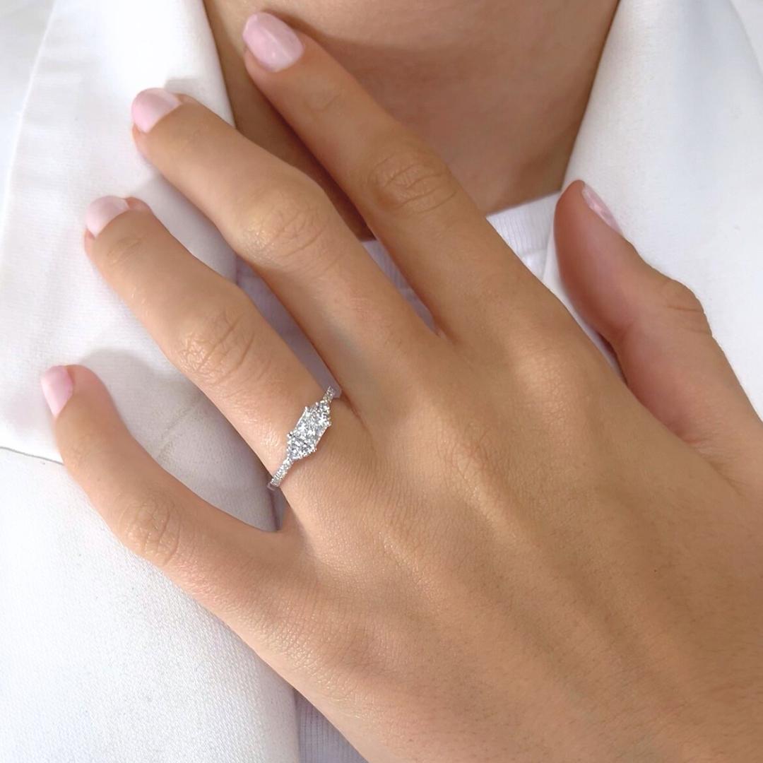 Elegant 0.75ct Diamonds Pave Ring in 18k White Gold - IGI Certified

This refined diamond ring exudes timeless grace, showcasing a dazzling 0.51ct princess-cut center diamond in exquisite color and clarity, renowned for its crisp brilliance and