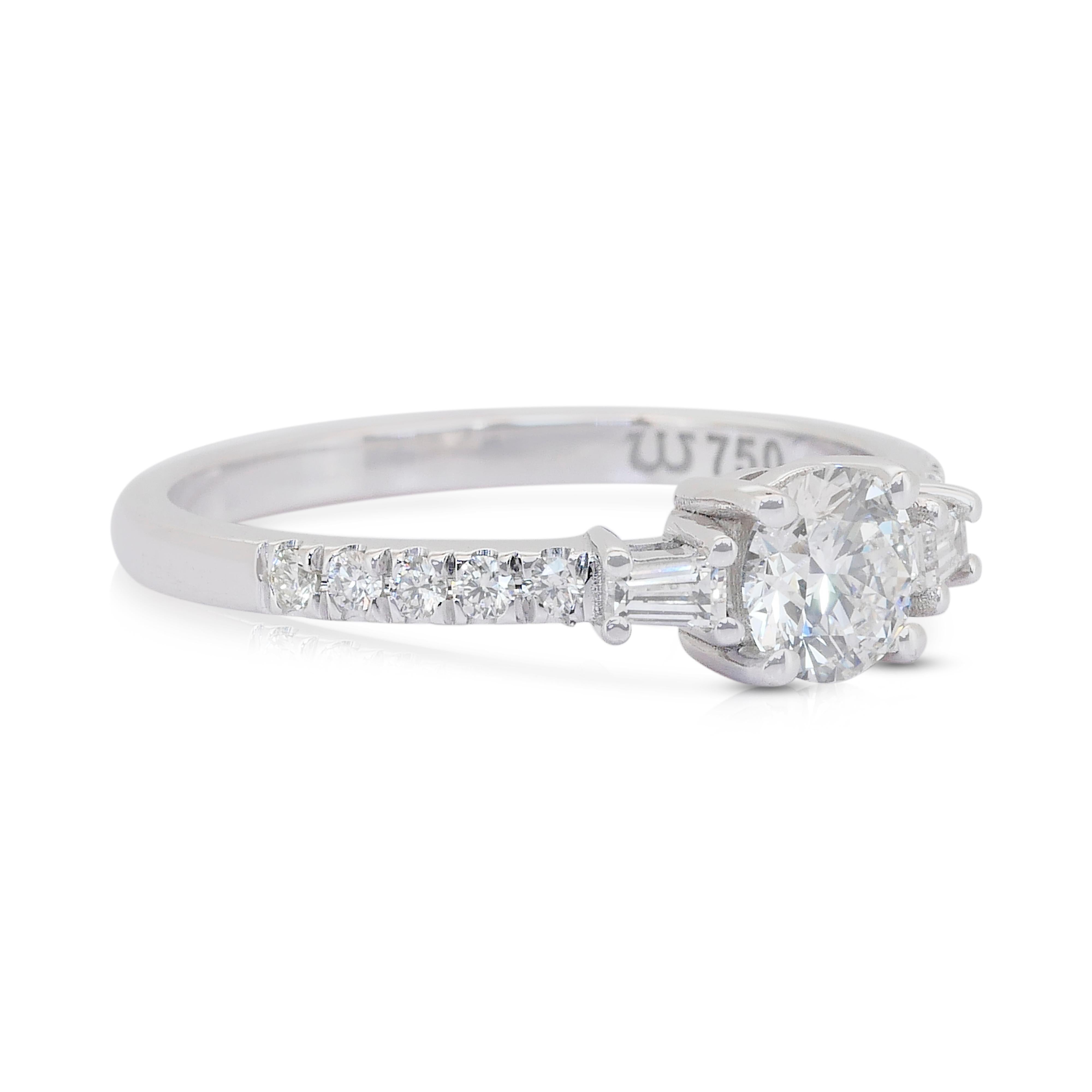 Elegant 0.78ct Diamonds Pave Ring in 18k White Gold - IGI Certified

Radiating elegance, this 18K white gold ring showcases a mesmerizing 0.51ct round brilliant diamond. Flanked by two exquisite tapered diamonds with 0.15ct total, and a halo of ten