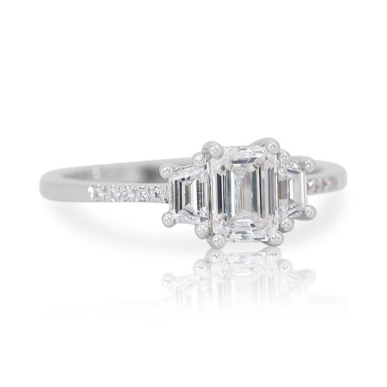 More than just a ring, this exquisite piece is a whispered promise of timeless elegance and enduring magic, written in 1.04 carats of captivating fire. Boasting the near-colorless E and E-F hues and near-flawless IF and VS1-VS2 clarity, the diamonds