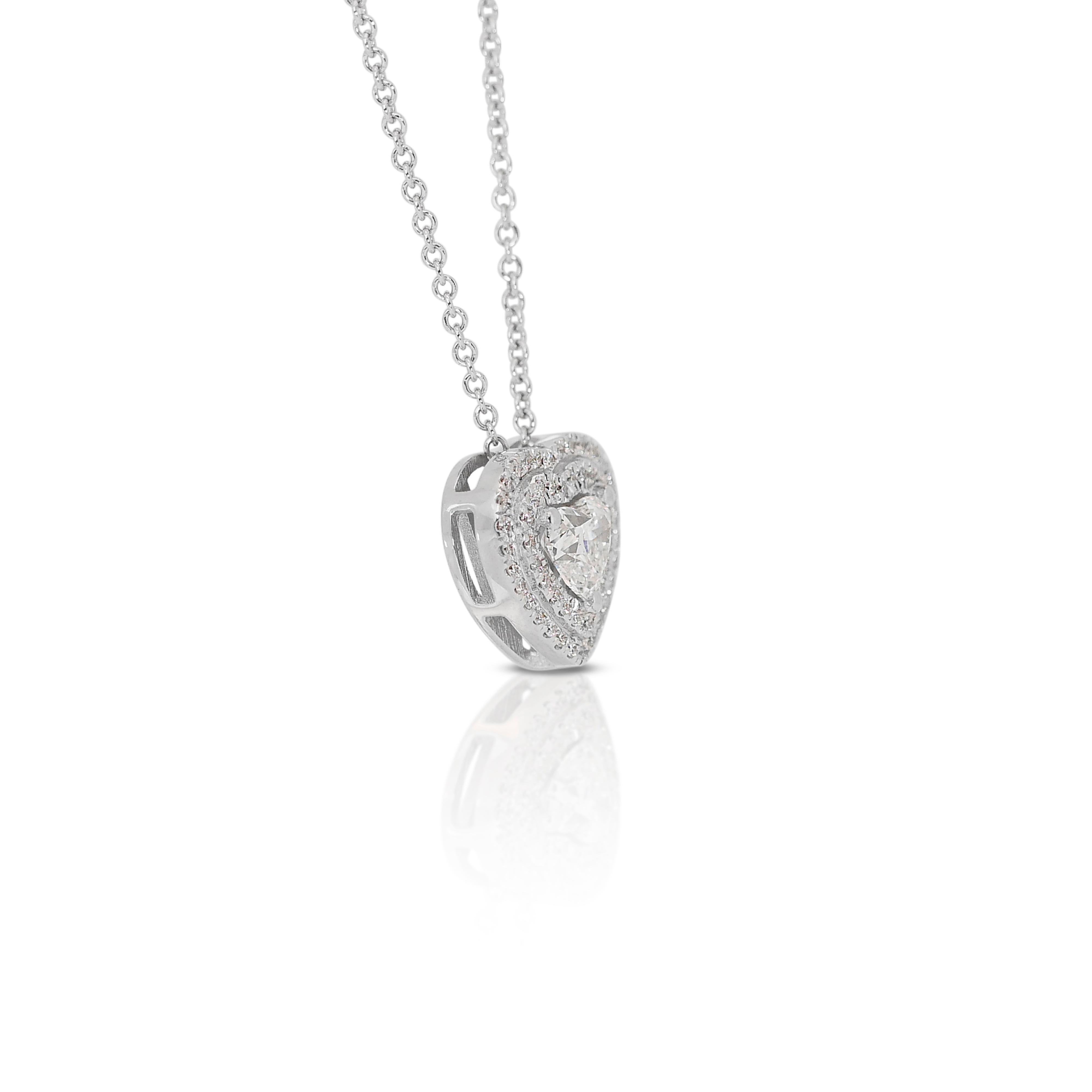 Elegant 0.80ct Heart-Shaped Diamond Halo Necklace in 18k White Gold - GIA Certified

Indulge in the timeless beauty of this 18k white gold halo necklace, featuring a stunning heart-shaped diamond as the centerpiece. The center stone is a 0.50-carat